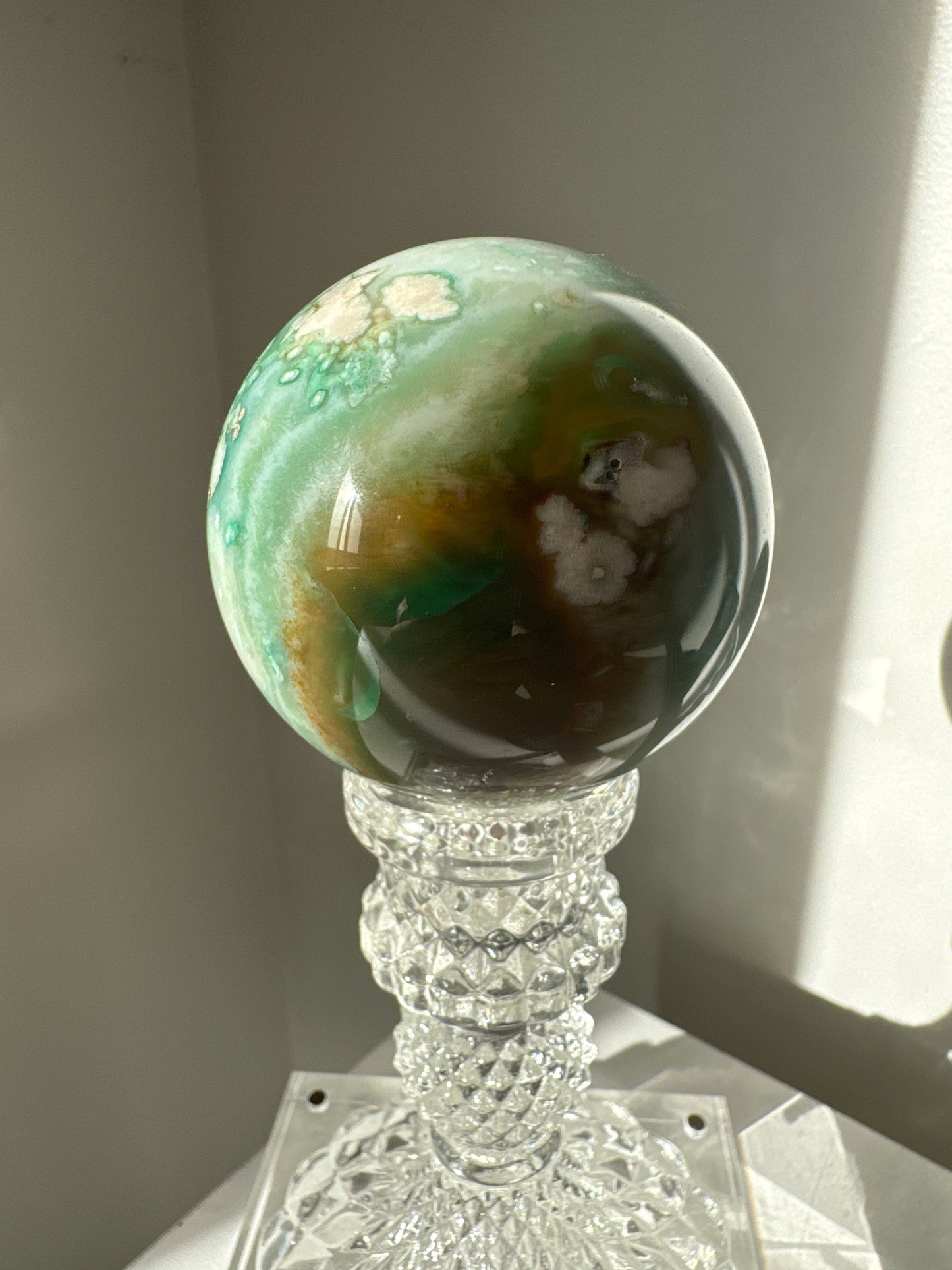 Green Flower Agate Sphere #3 featuring earthy green and brown tones with intricate mineral formations, perfect for bespoke crystal collections.