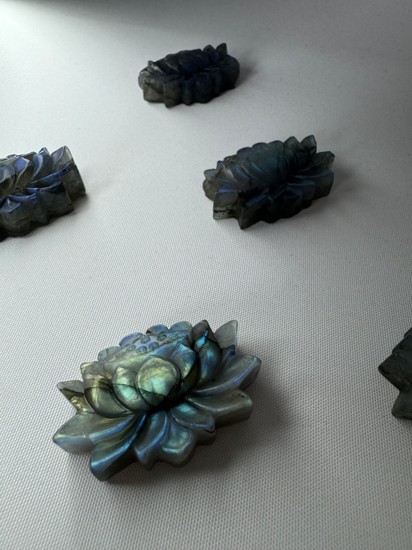 Labradorite Crystal Lotus Carving | Bespoke Crystals showcasing iridescent rainbow hues and intricate lotus detailing.