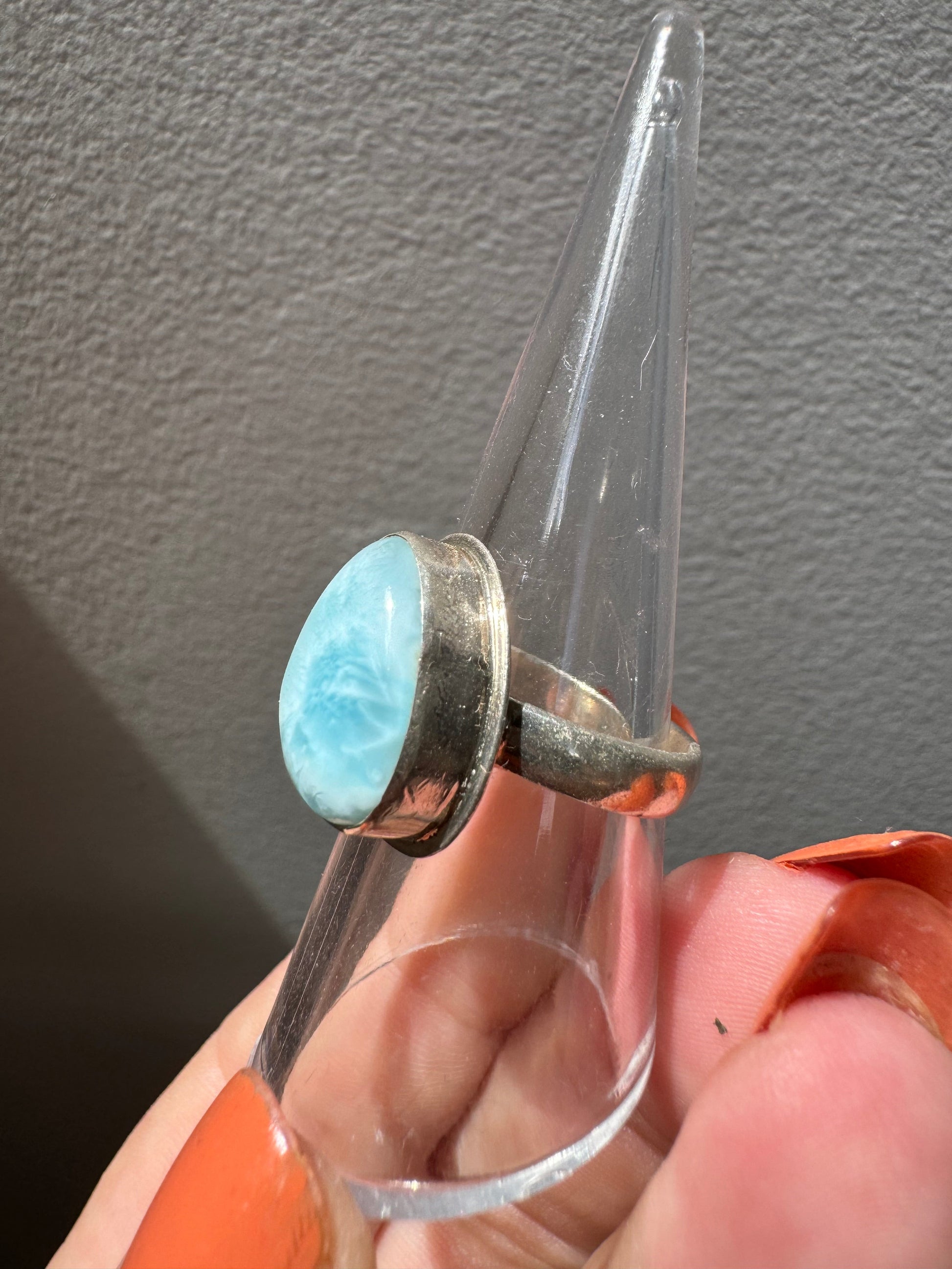 Side view of Larimar Crystal Ring #2 | Bespoke Crystals showing the polished silver band and domed Larimar gemstone with ocean-like patterns.