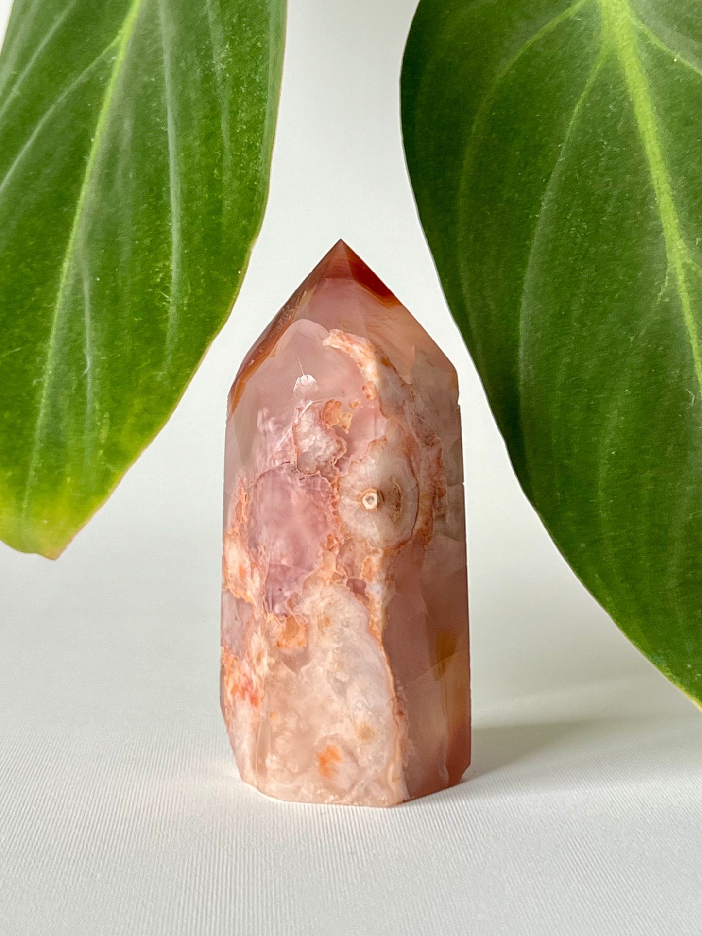 Polished Flower Agate Carnelian Healing Point with intricate natural patterns, perfect for promoting creativity, courage, and spiritual growth.