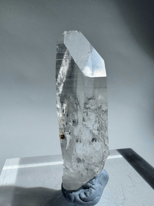 Crystal Lemurian Seed - Silver Light Quartz with striated sides and high clarity, ideal for intuition and purification in meditation practices.