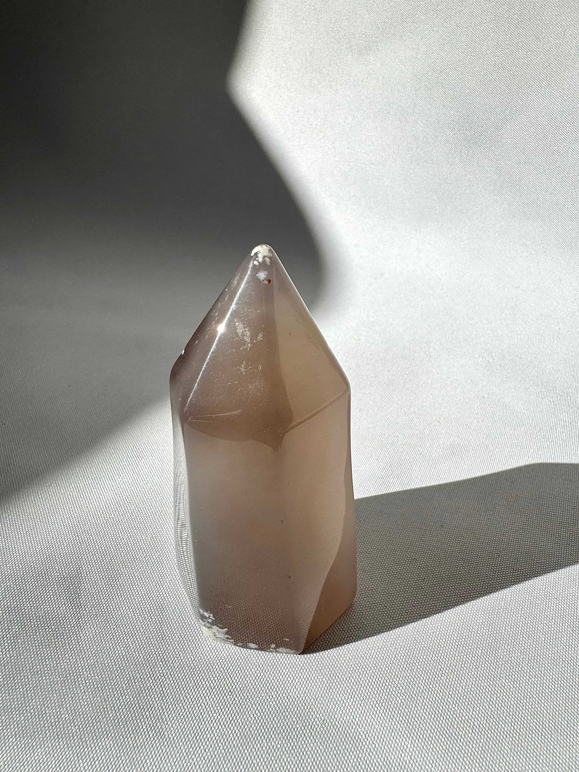 Polished Agate Crystal Druze Point #4 with smooth grey tones , a distinctive piece for crystal collectors.