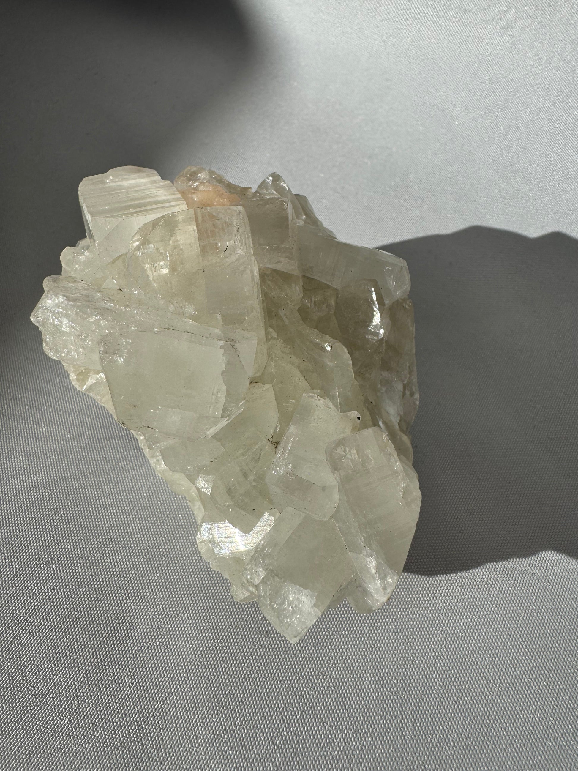 Apophyllite Crystal Cluster #1 displaying a unique crystalline structure and reflective surfaces, perfect for crystal collectibles.