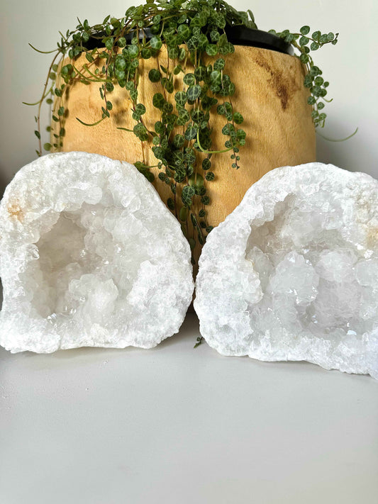Clear Quartz Crystal Geode | Bespoke Crystals displayed in two halves with sparkling interiors, ideal for collectors and crystal healing enthusiasts.