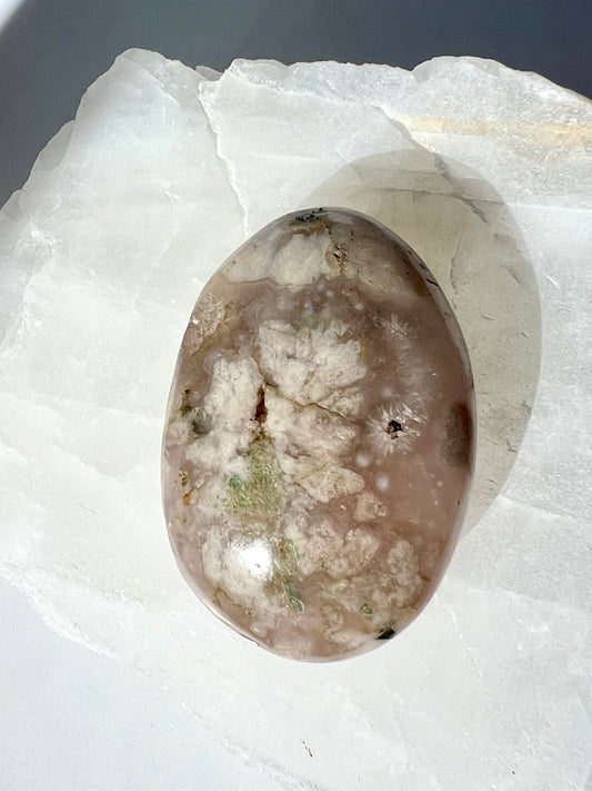 Polished Flower Agate Crystal Palm Stone from Bespoke Crystals, showcasing soft pink hues and floral-like inclusions, ideal for emotional healing.