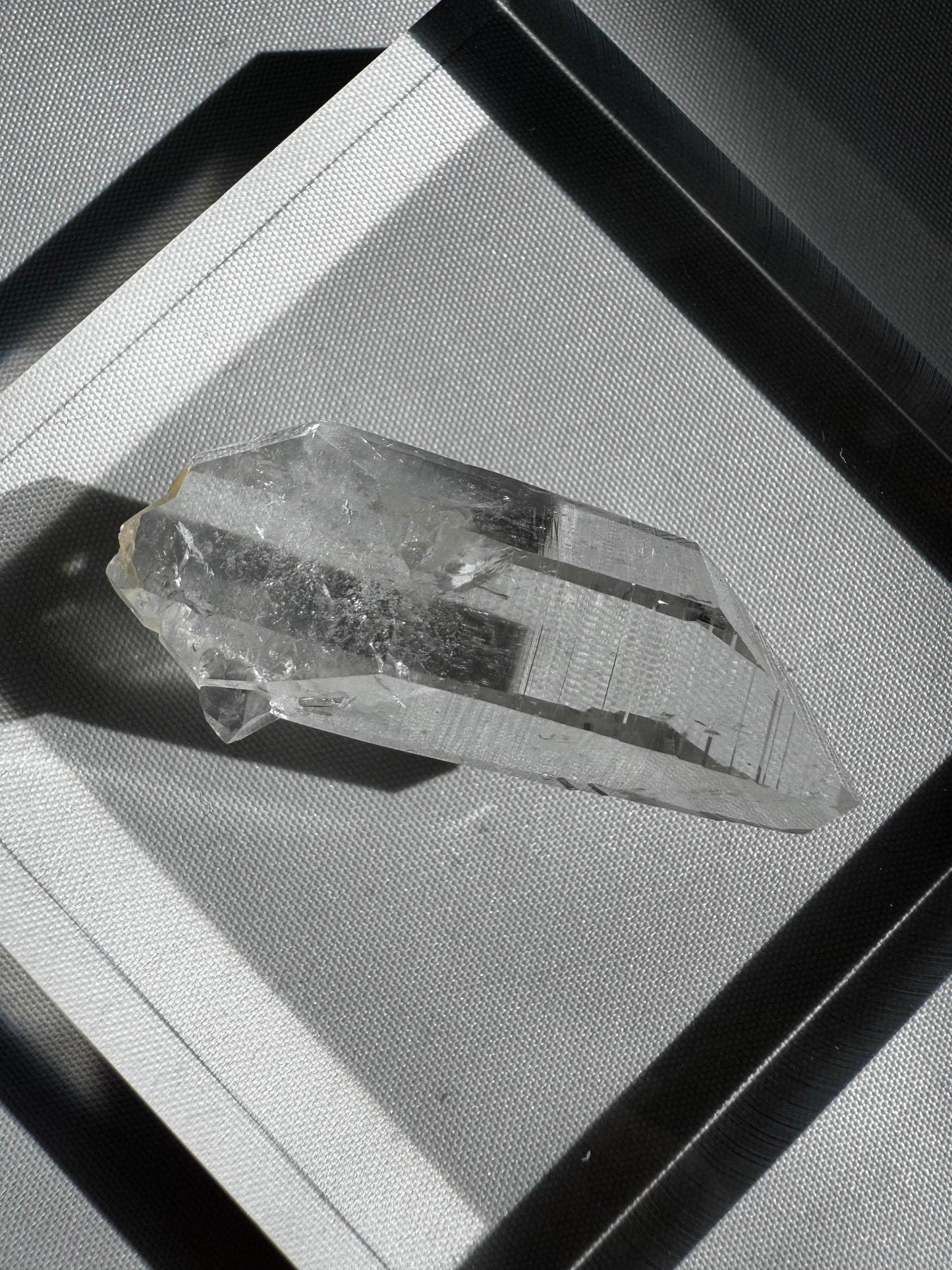 Silver Light Crystal Lemurian Seed Point DT gemstone with high clarity and striations, ideal for collectors and spiritual healing practices.