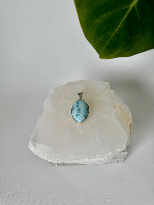 Larimar Crystal Pendant - Peace & Clarity , showcasing its ocean-blue hues and silver setting for healing energy Crystal Jewellery NZ