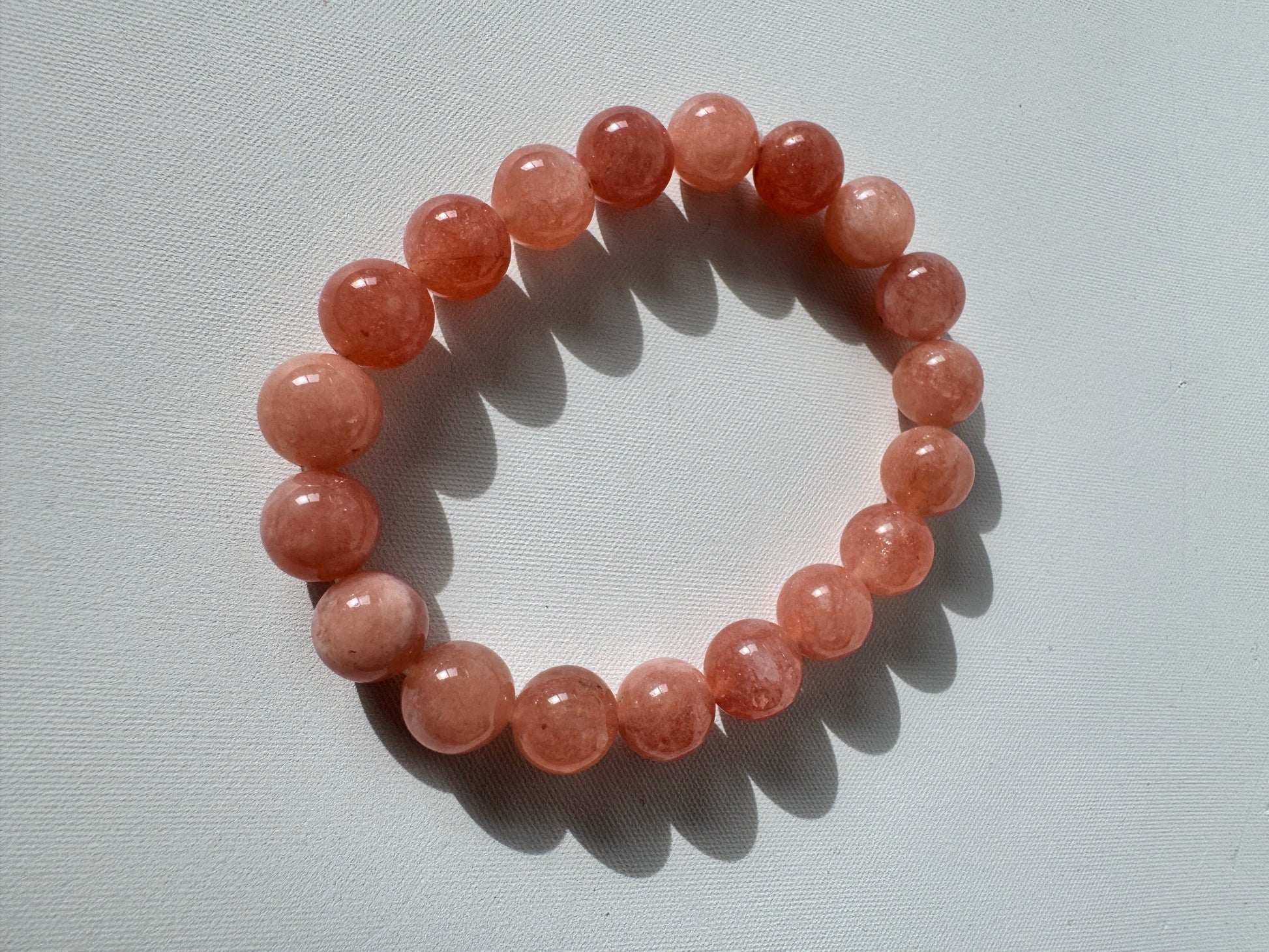 Sunstone Crystal Bracelet 10mm featuring round polished beads with a warm, sparkling finish, ideal for boosting joy and confidence.