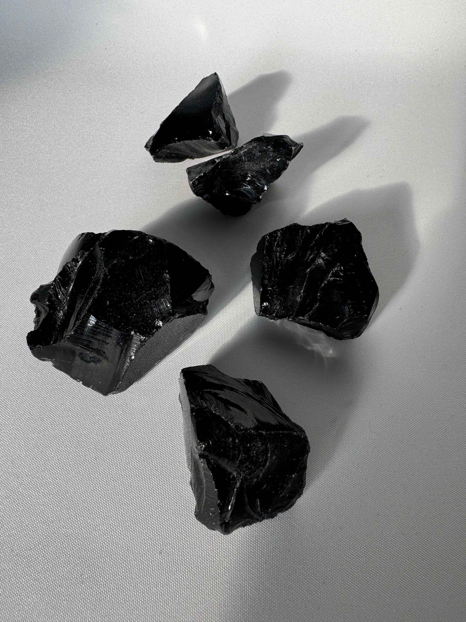 Black Obsidian Crystal Rough Piece | Bespoke Crystals featuring five glossy, jagged volcanic glass stones ideal for grounding and protection rituals.