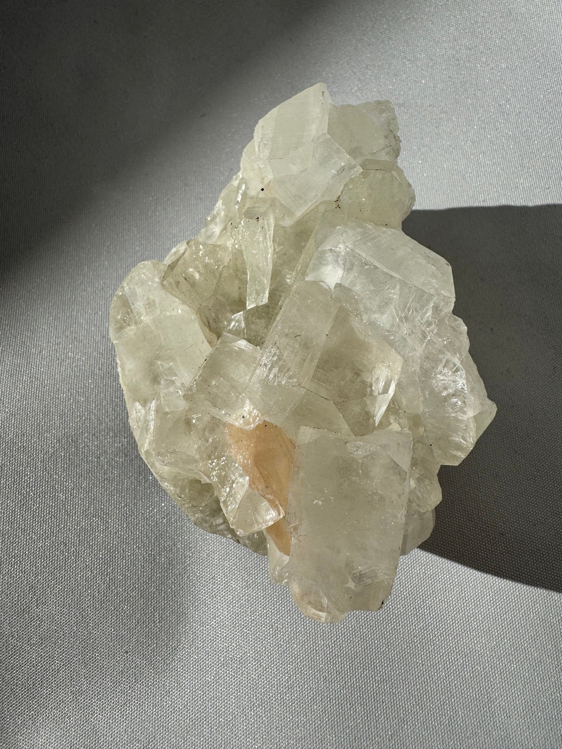 Apophyllite Crystal Cluster #1 with clear and greenish hues, showcasing its calming and clarity-enhancing properties