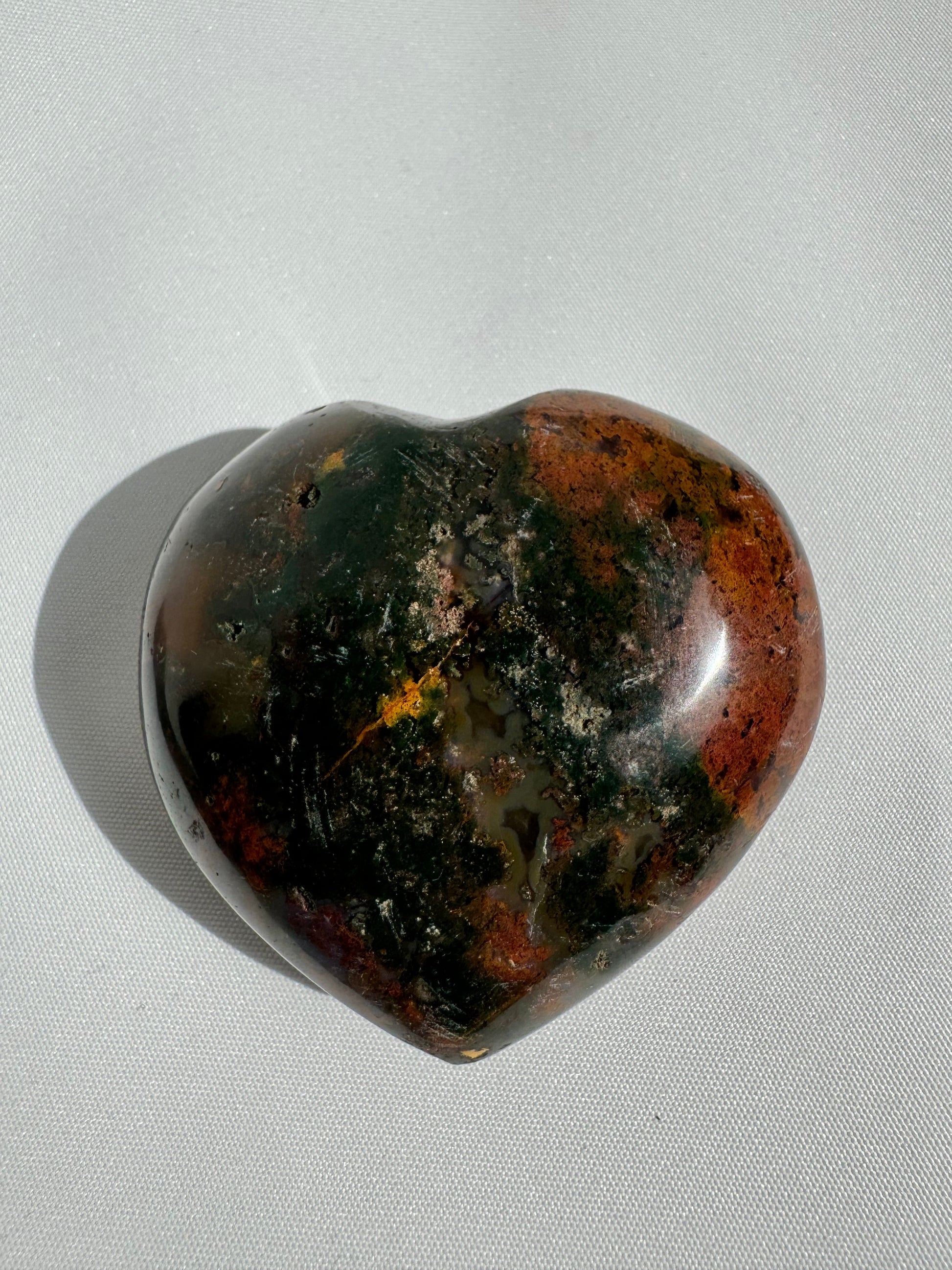 Ocean Jasper Crystal Heart #1 with deep green, red, and earthy tones, polished to a smooth finish. Ideal for collectors of rare Madagascar stones.
