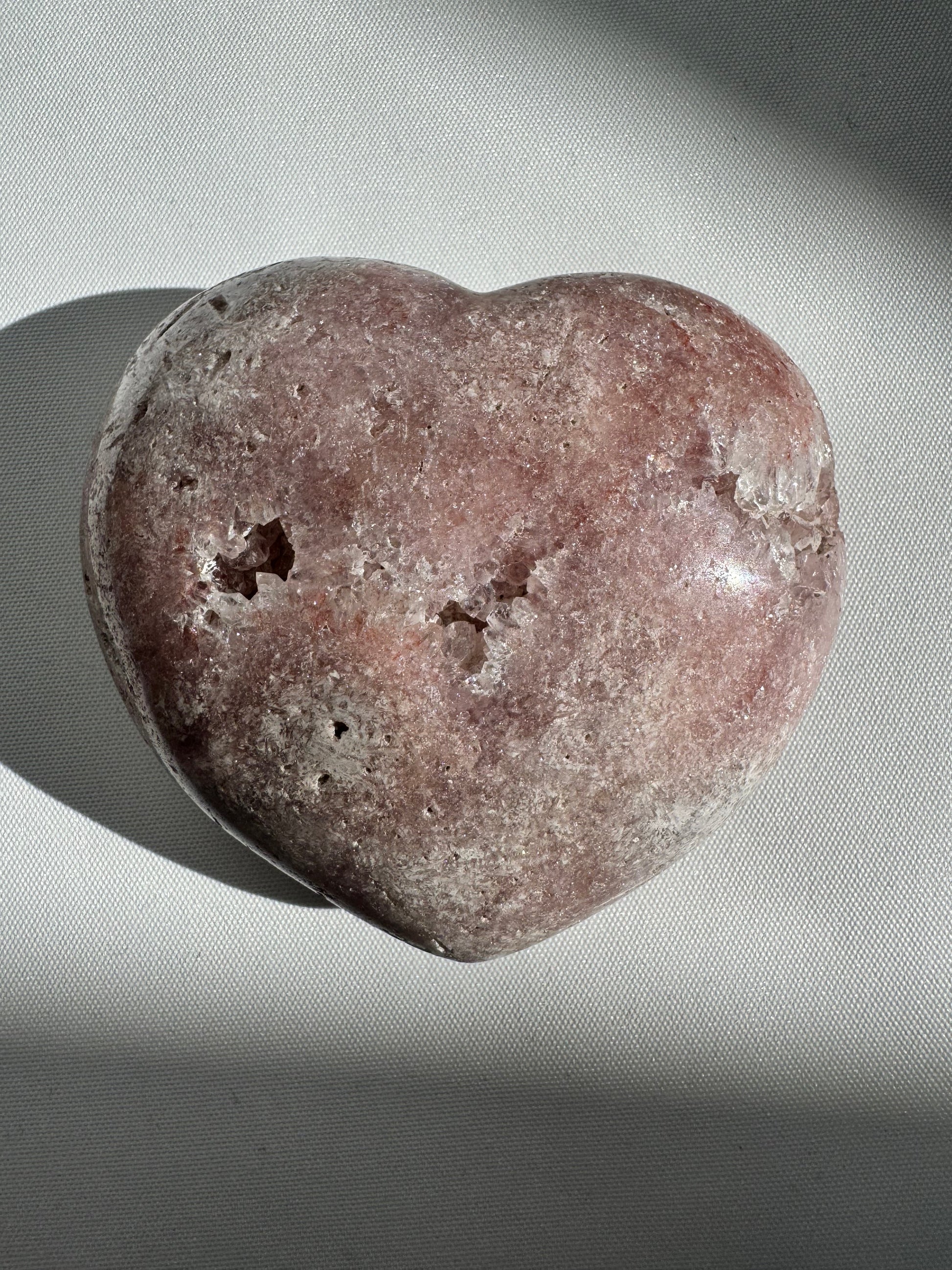 Rare Pink Amethyst Crystal Heart from Patagonia, Argentina, showcasing soft pink hues and textured surface for decorative or metaphysical use.