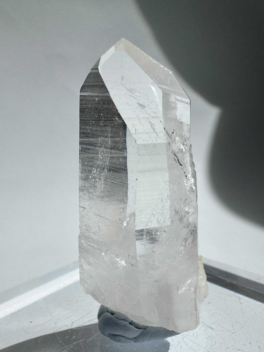 Lemurian Seed Point - Silver Light Crystal with striated sides and a clear termination, ideal for healing and spiritual practices in NZ.
