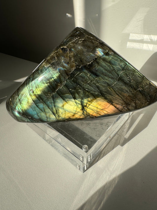 Labradorite Crystal Freeform #A07 with vibrant blue and gold flash on a clear acrylic stand, ideal for collectors of bespoke crystals.