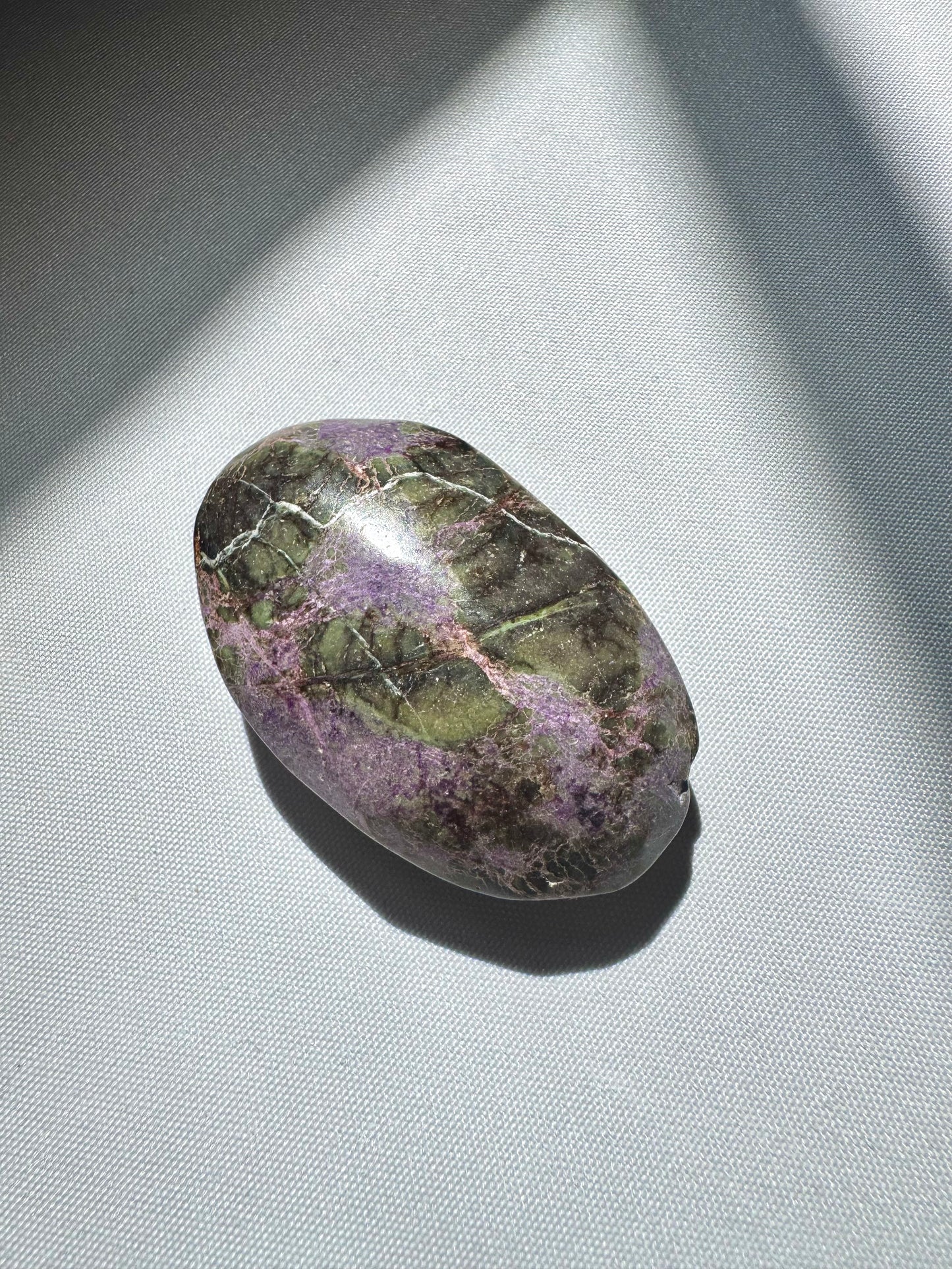 Unique Atlantisite Crystal Palm Stone with deep green and purple veining, a collectible item in the rocks and fossils category.