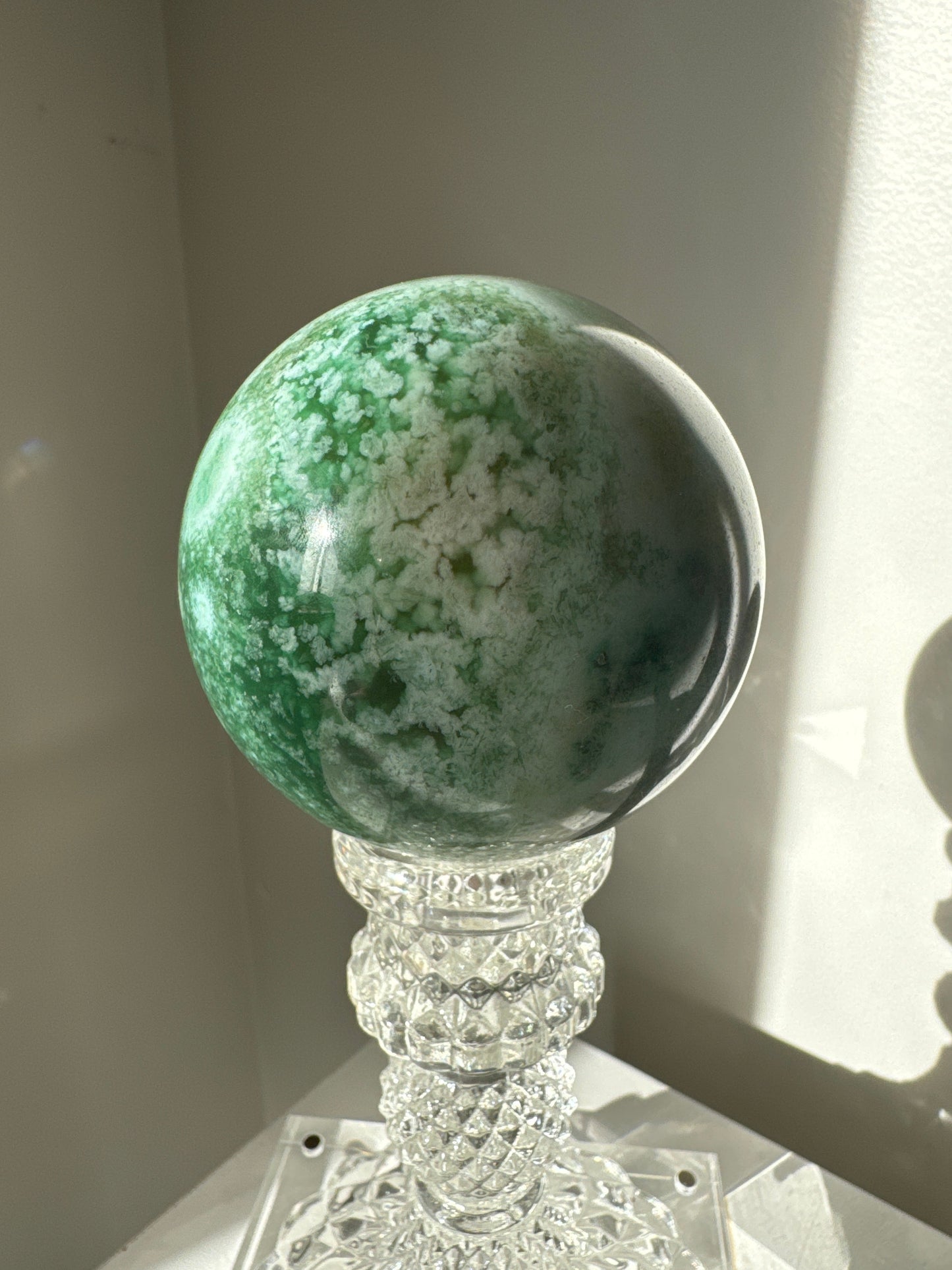 Green Flower Agate Crystal Sphere #2 featuring floral-like white inclusions on a deep green base, perfect for emotional healing and decor.