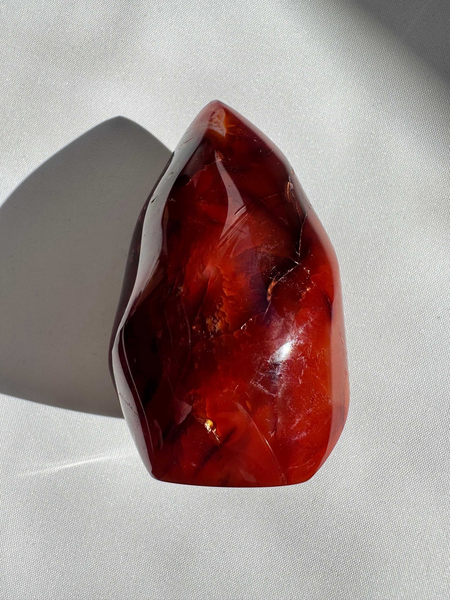 Carnelian Crystal Flame with deep red hues and polished flame shape | Bespoke Crystals