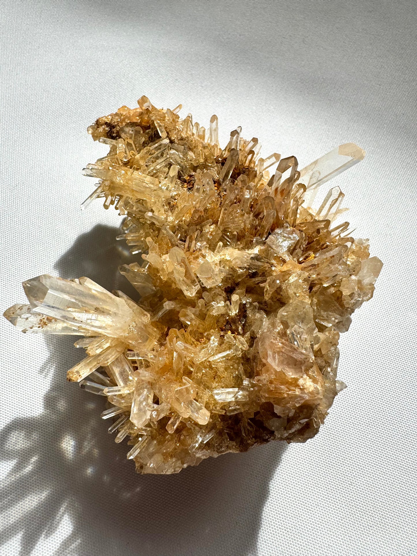 Blue Smoke Halloysite-Included Lemurian Crystal Cluster with golden striated quartz points on white background, ideal for collectors and metaphysical use.