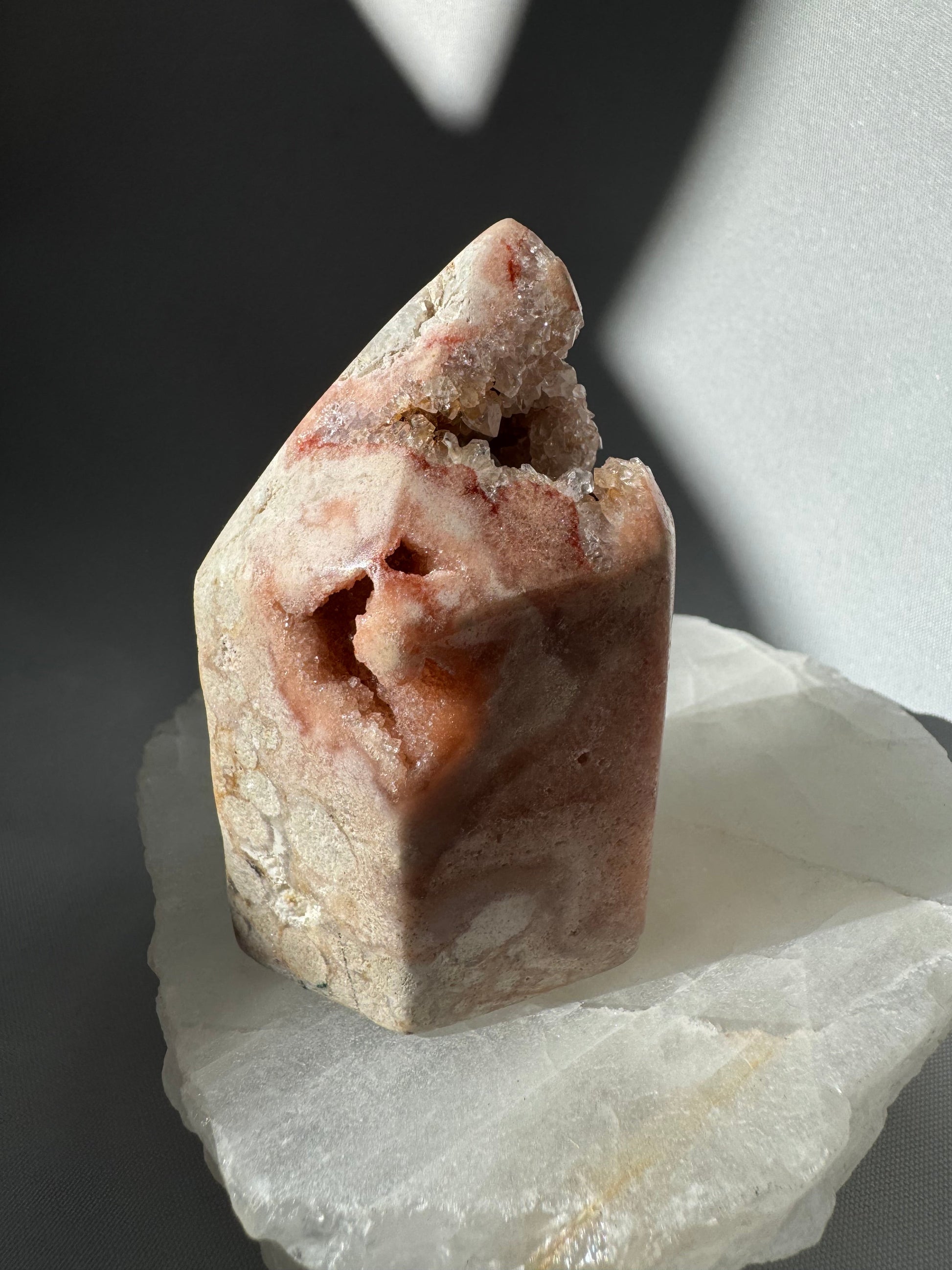 Angled view of Pink Amethyst Crystal Tower showing a deep geode cavity and rich pink coloration. Perfect for bespoke crystal and gemstone enthusiasts.