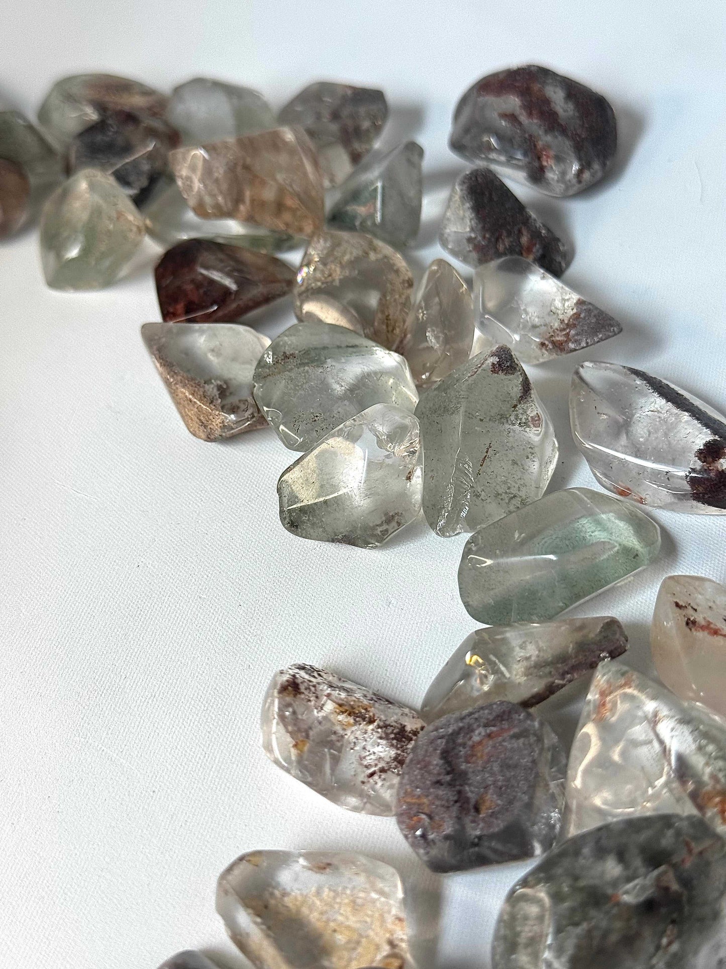Handpicked Lodalite tumble stones featuring natural inclusions, perfect for enhancing focus and dream work. Shop Garden Quartz crystals in NZ.