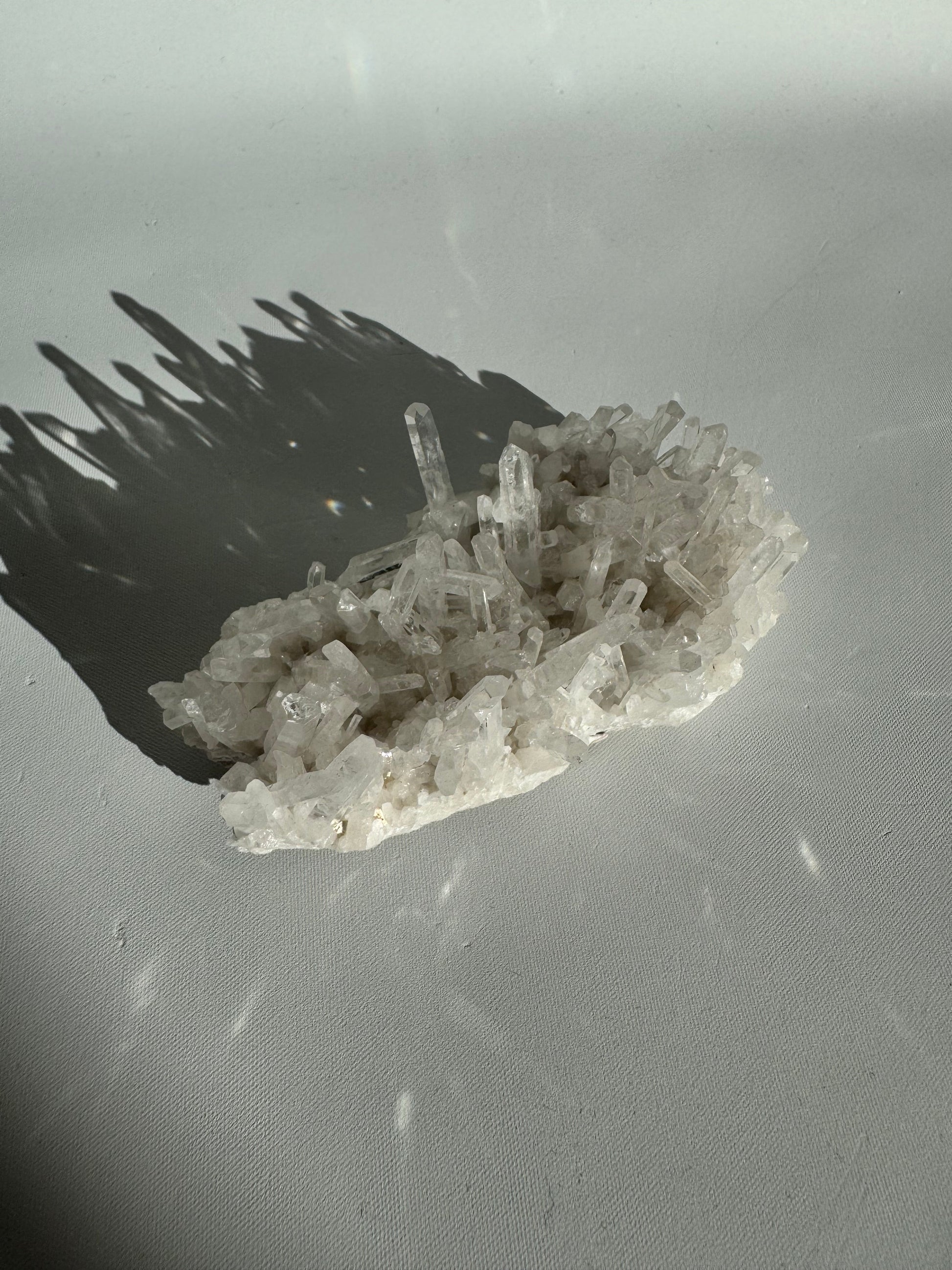 Compact Needle Quartz Crystal Cluster with shimmering needle-like points, ideal for decorative use or geological collections.