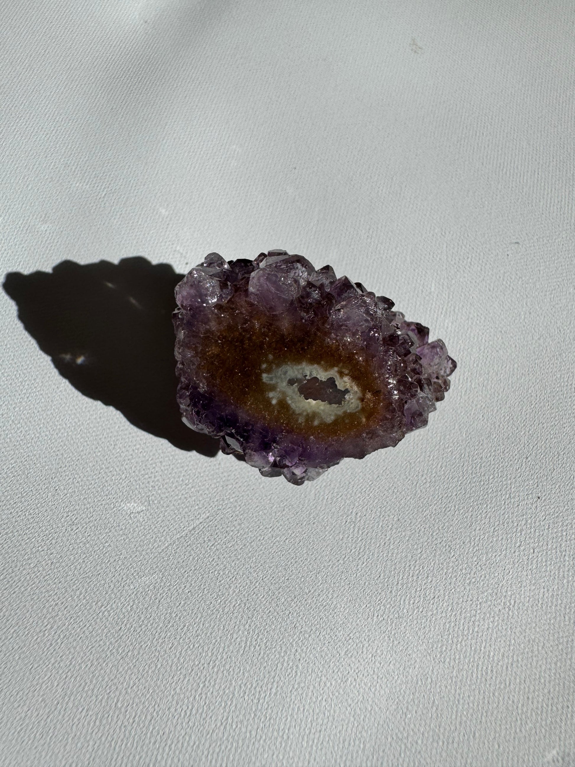 Small Amethyst Crystal Stalactite Grade A with subtle purple and brown hues, showcasing natural crystal growth and geode texture.