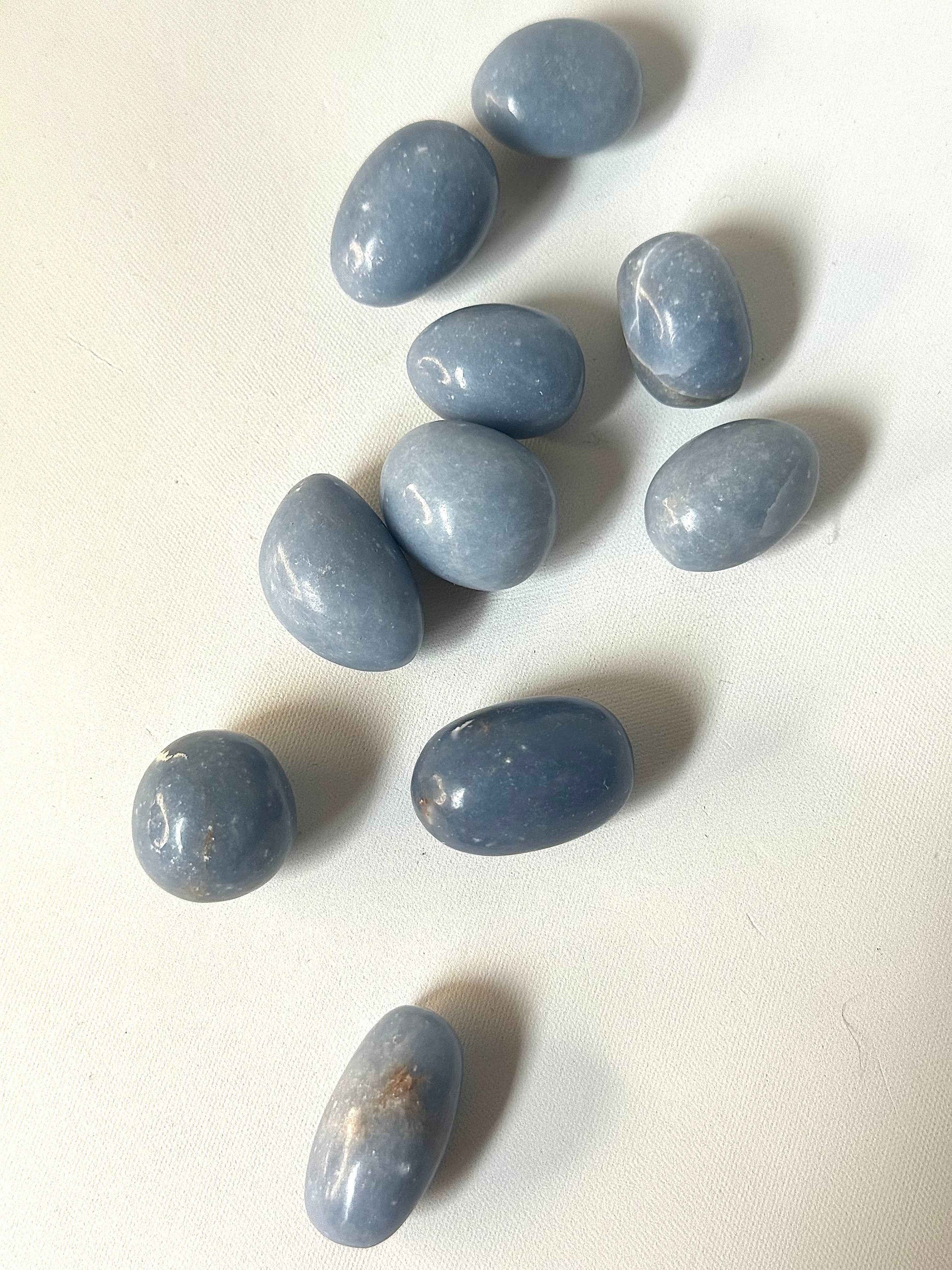 Angelite Crystal Stones - Communication | Serenity | Growth | Peace. Polished blue Angelite tumble stones for spiritual healing and emotional balance.