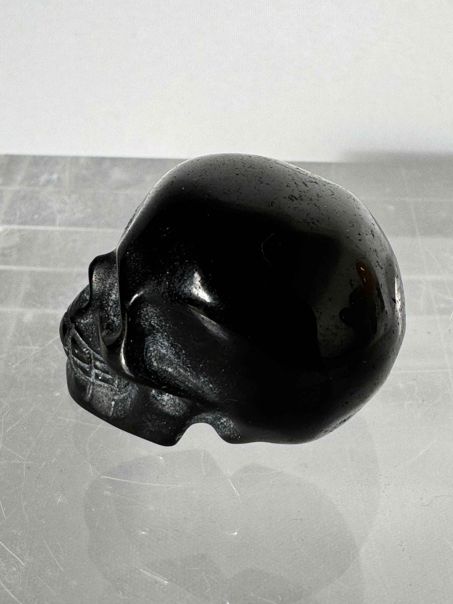 Side view of Small Black Obsidian Crystal Skull for grounding and energy shielding | Bespoke Crystals