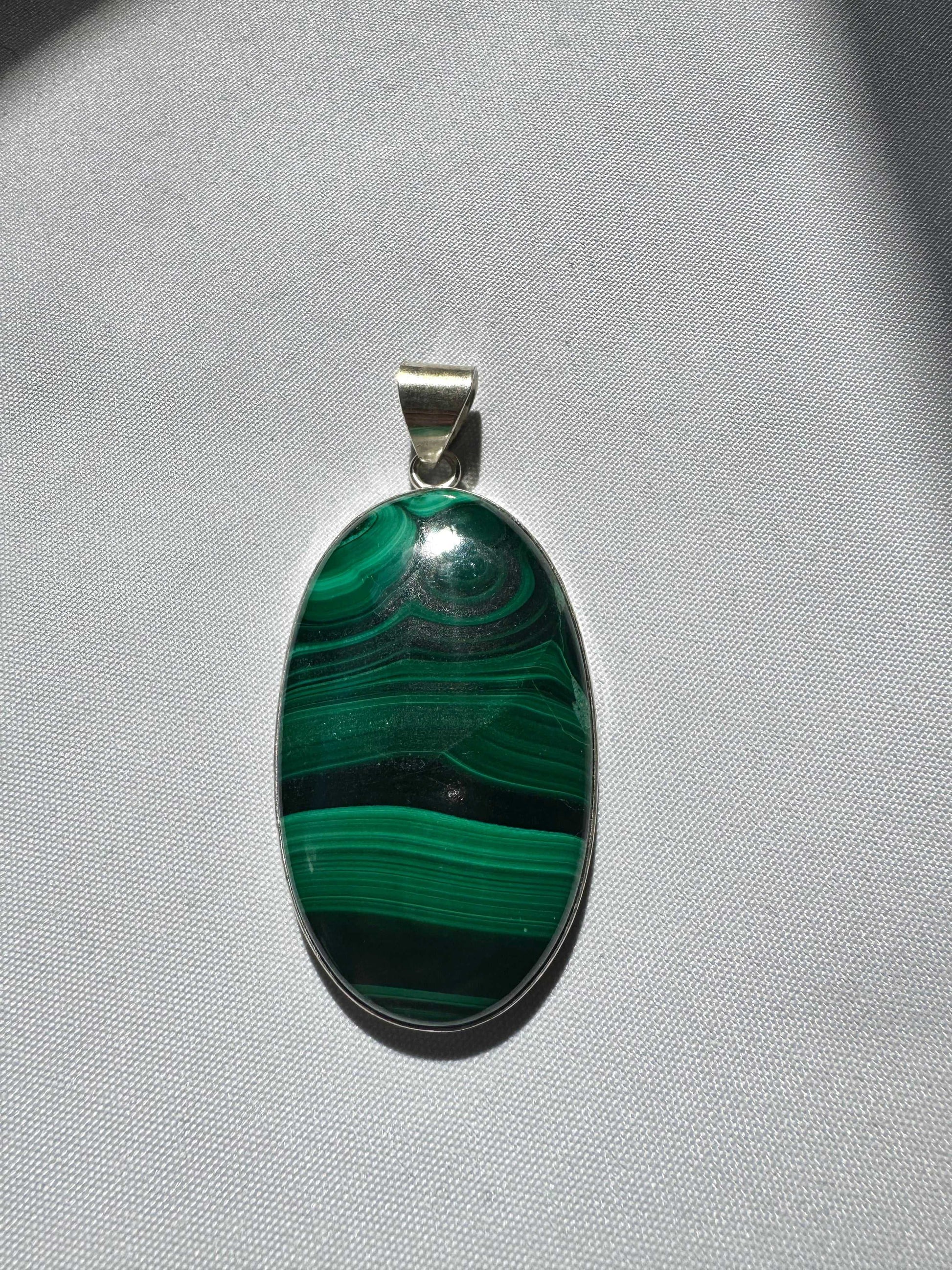 Bespoke Malachite Pendant showcasing vivid green swirls and bands | Healing crystal jewellery  New Zealand.