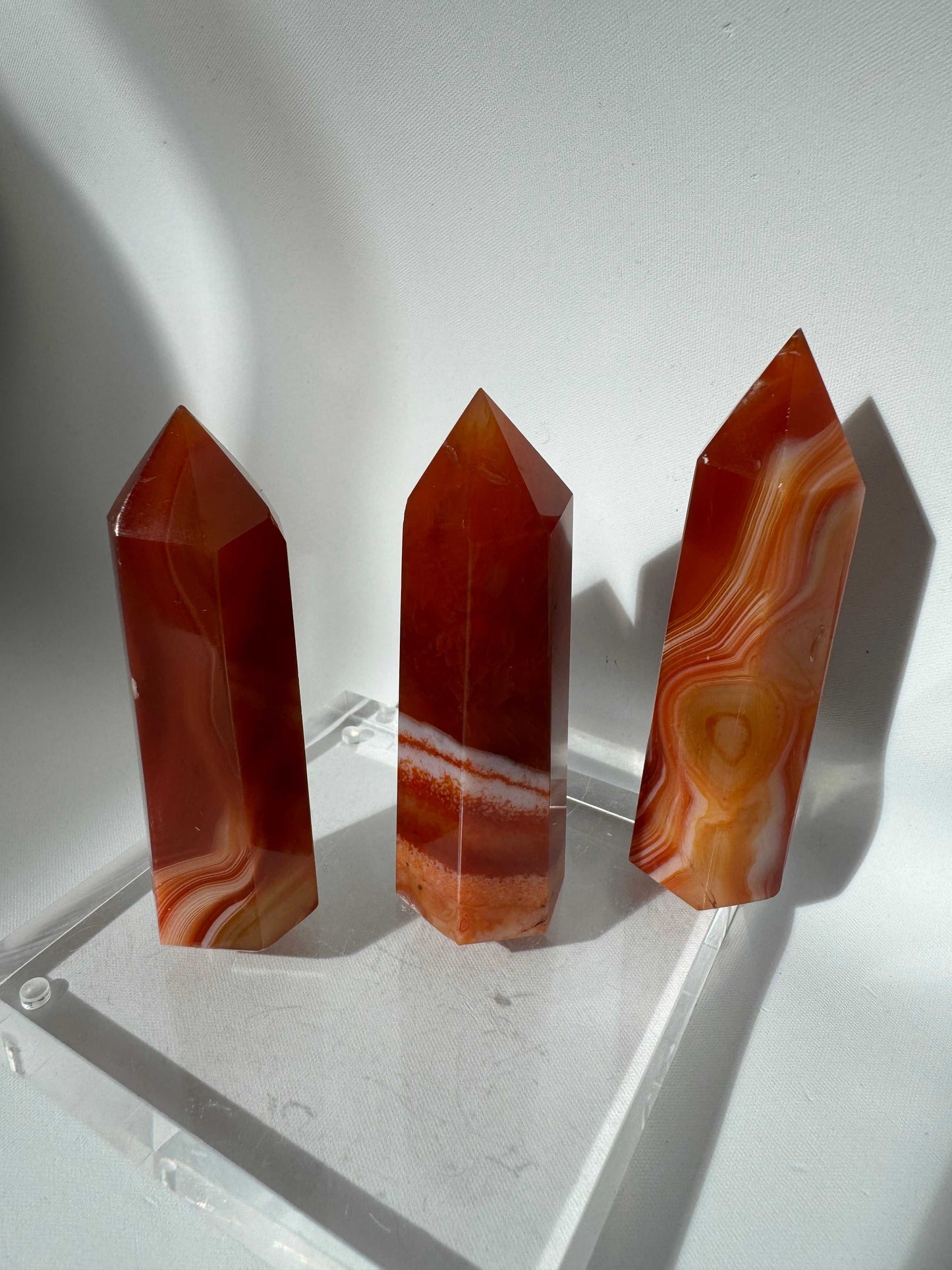 Carnelian Crystal Points | Bespoke Crystals | showcasing three vibrant carnelian towers