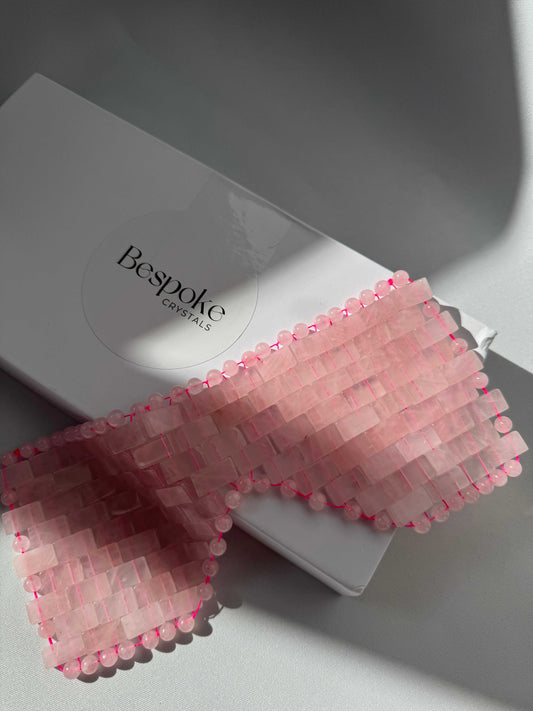 Rose Quartz Crystal Eye Mask by Bespoke Crystals displayed on branded packaging. Ideal for soothing skin and reducing puffiness naturally.