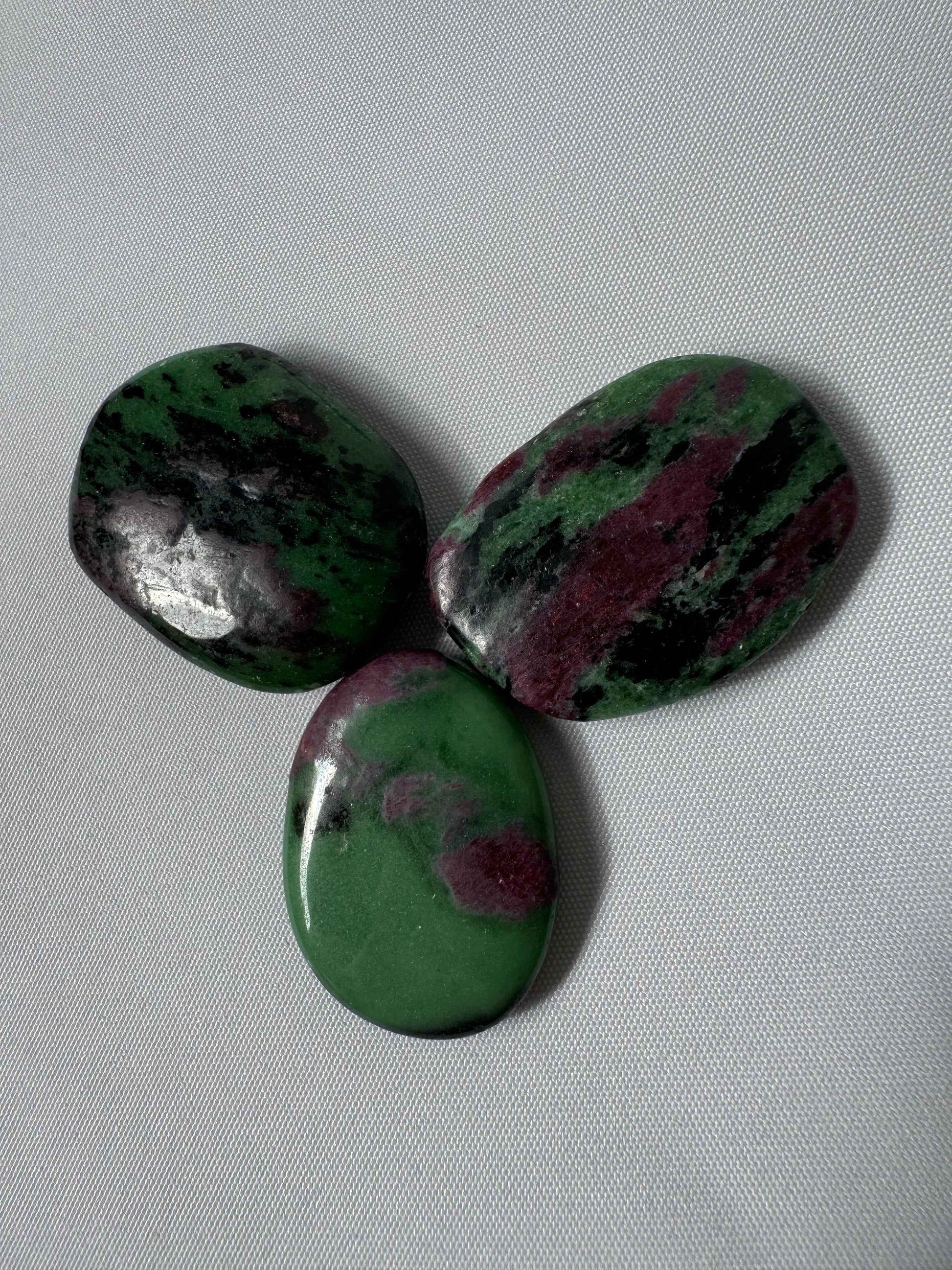 Set of three Ruby Zoisite Crystal Flat Stones featuring unique green and red patterns, perfect for collectors and energy work.