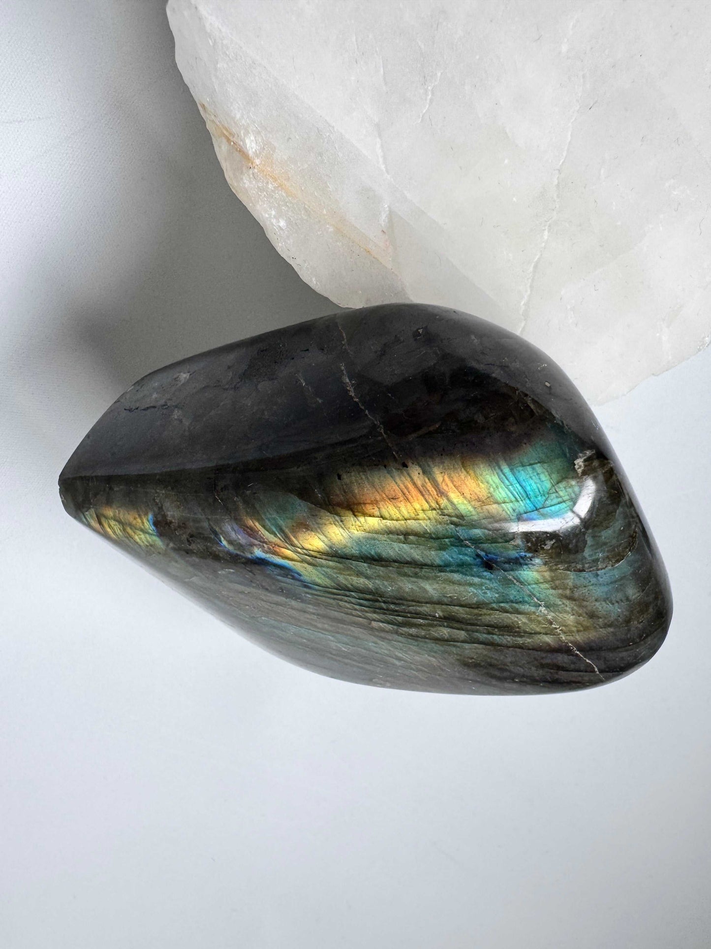 Top view of Labradorite Crystal Freeform A04 showcasing iridescent sheen and smooth finish. A collectible crystal from the Bespoke Crystals range.