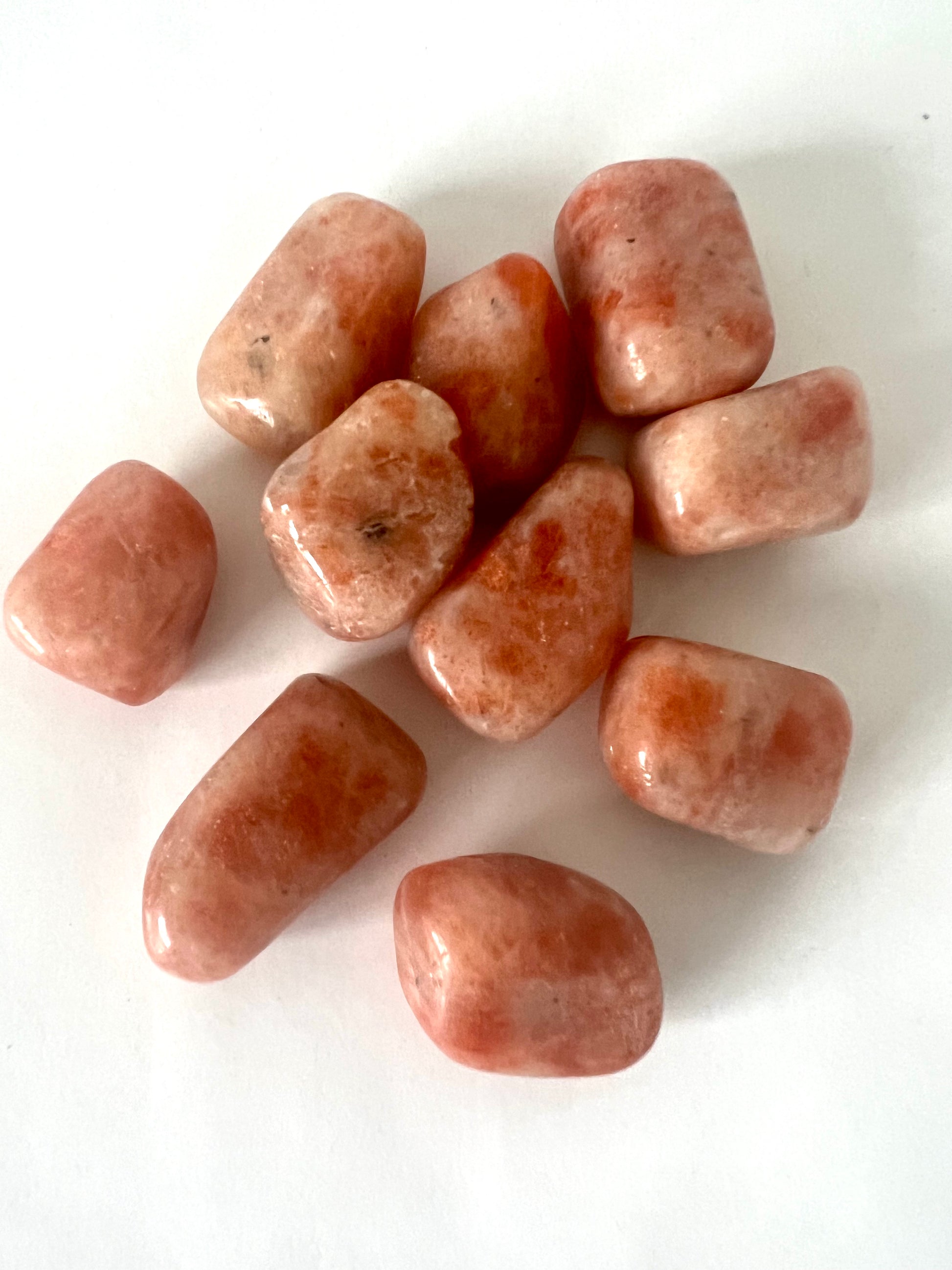 Sunstone Tumble Stone - Shop Online | Bespoke Crystals. Polished orange sunstone crystals with radiant shimmer, ideal for chakra healing and joy.