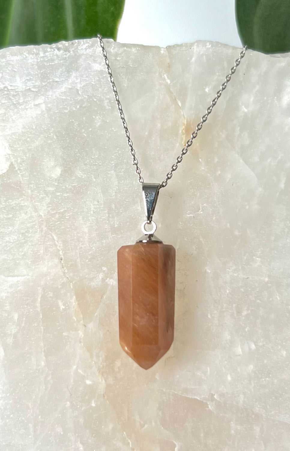 Red Amphibole Quartz Pendant featuring vibrant red hues and polished point cut | Bespoke Crystals NZ