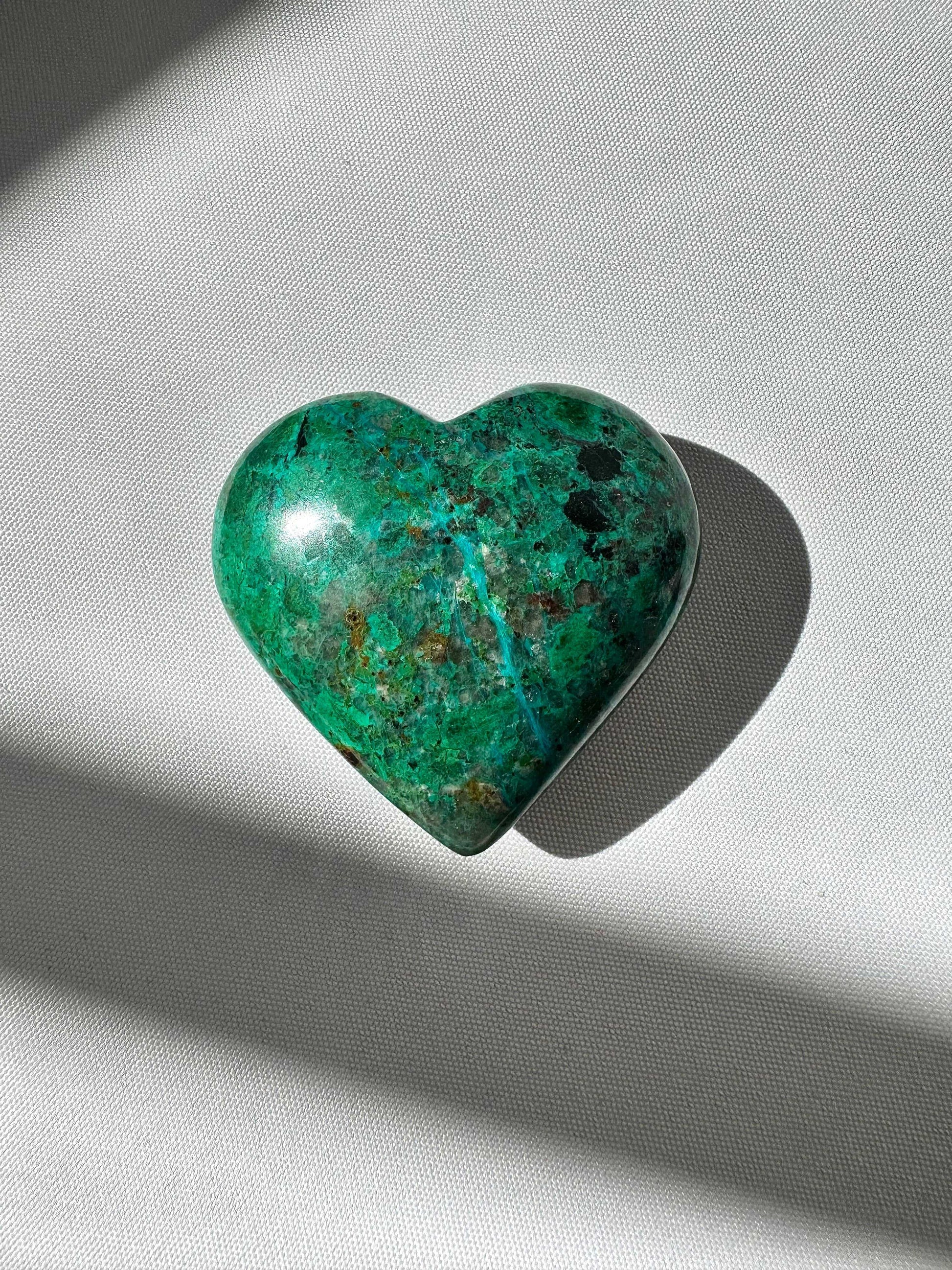 Polished Malacolla Crystal Heart #3 featuring rich green, blue, and brown tones, displayed under natural light | Bespoke Crystals