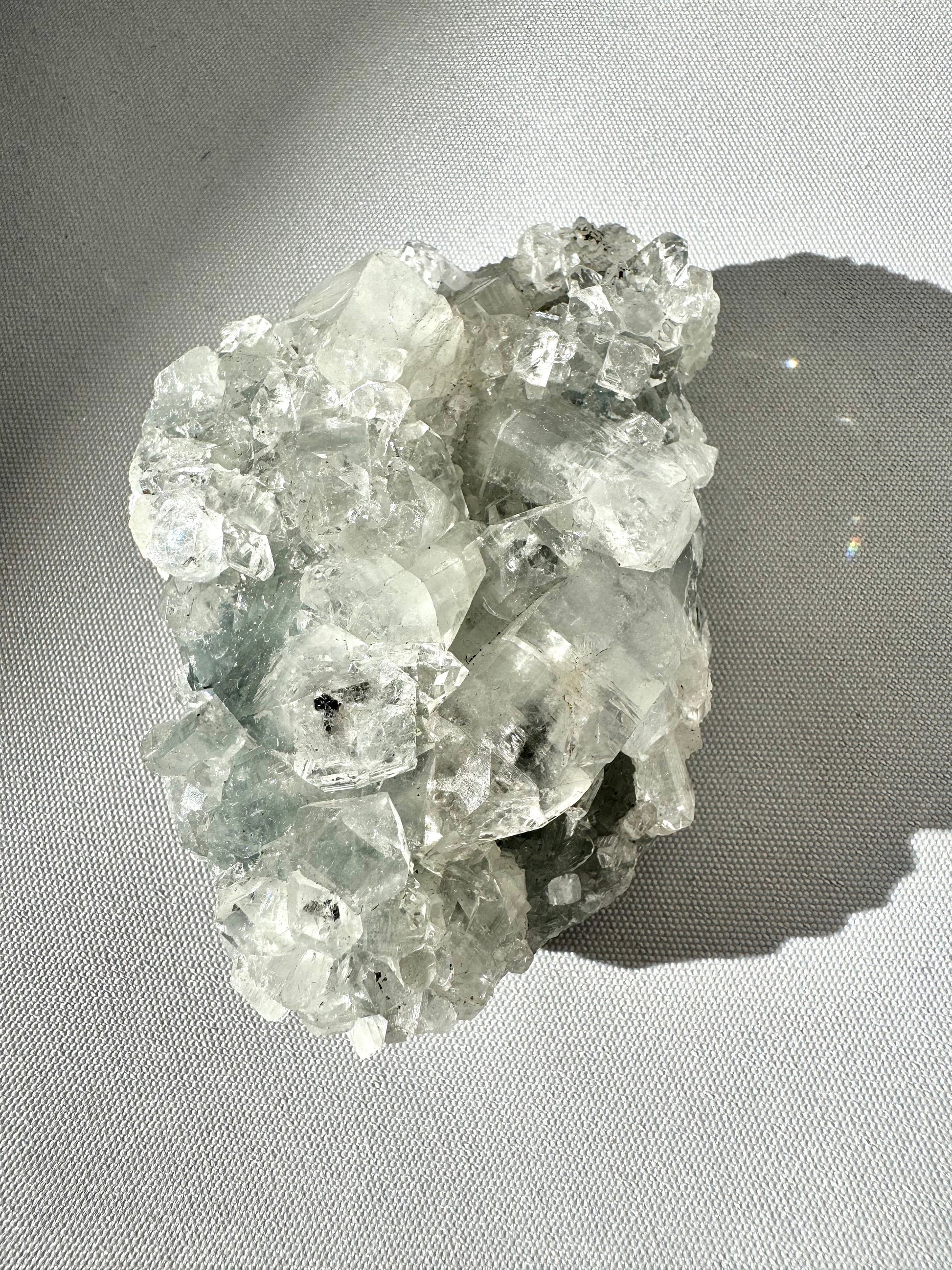 Apophyllite Crystal Cluster #3 showcasing intricate crystal structures and natural sparkle, a collectible .