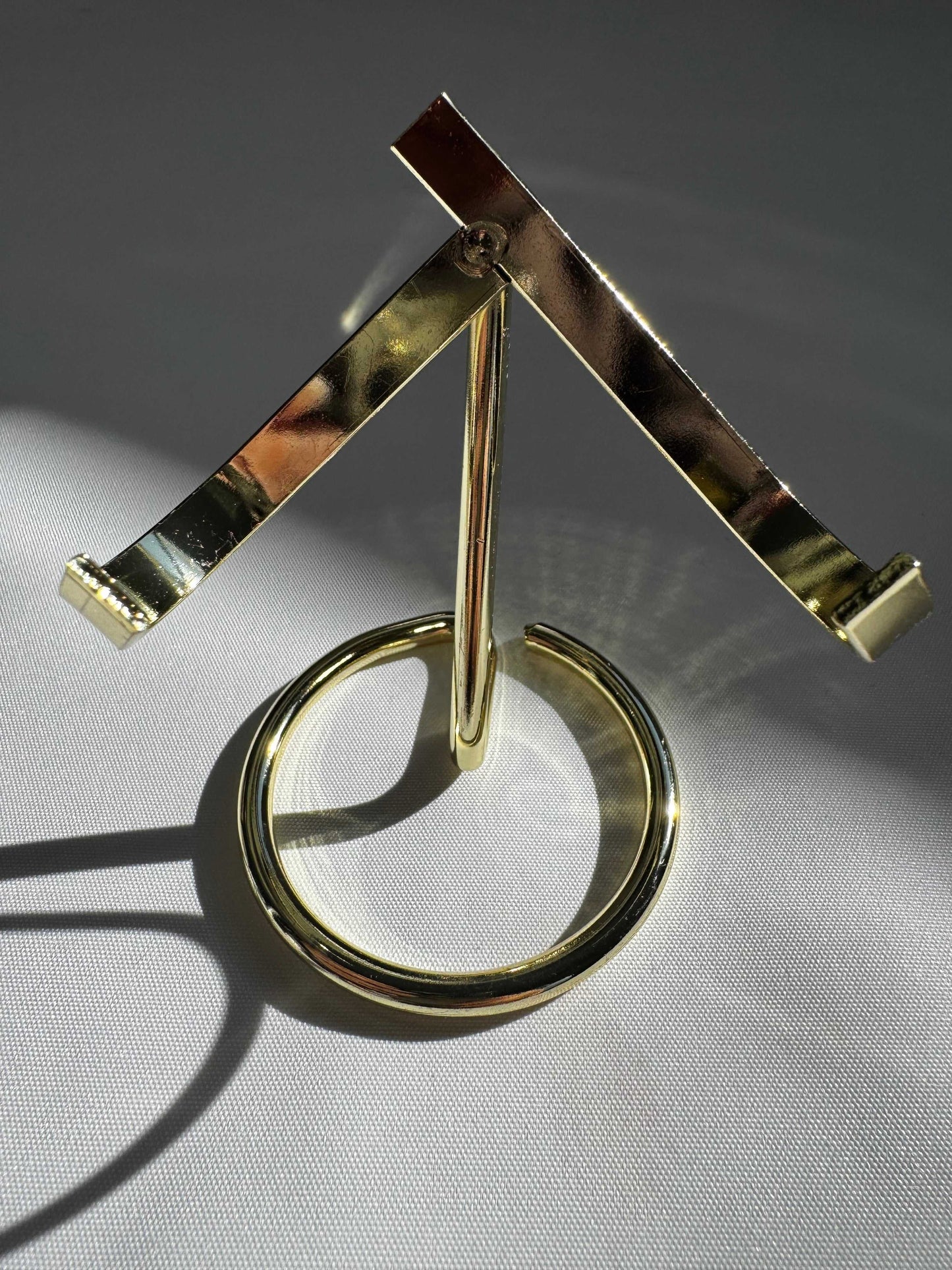 Elegant Gold Crystal Display Stand | Bespoke Crystals, featuring a sturdy round base and V-shaped arms for crystal presentation.