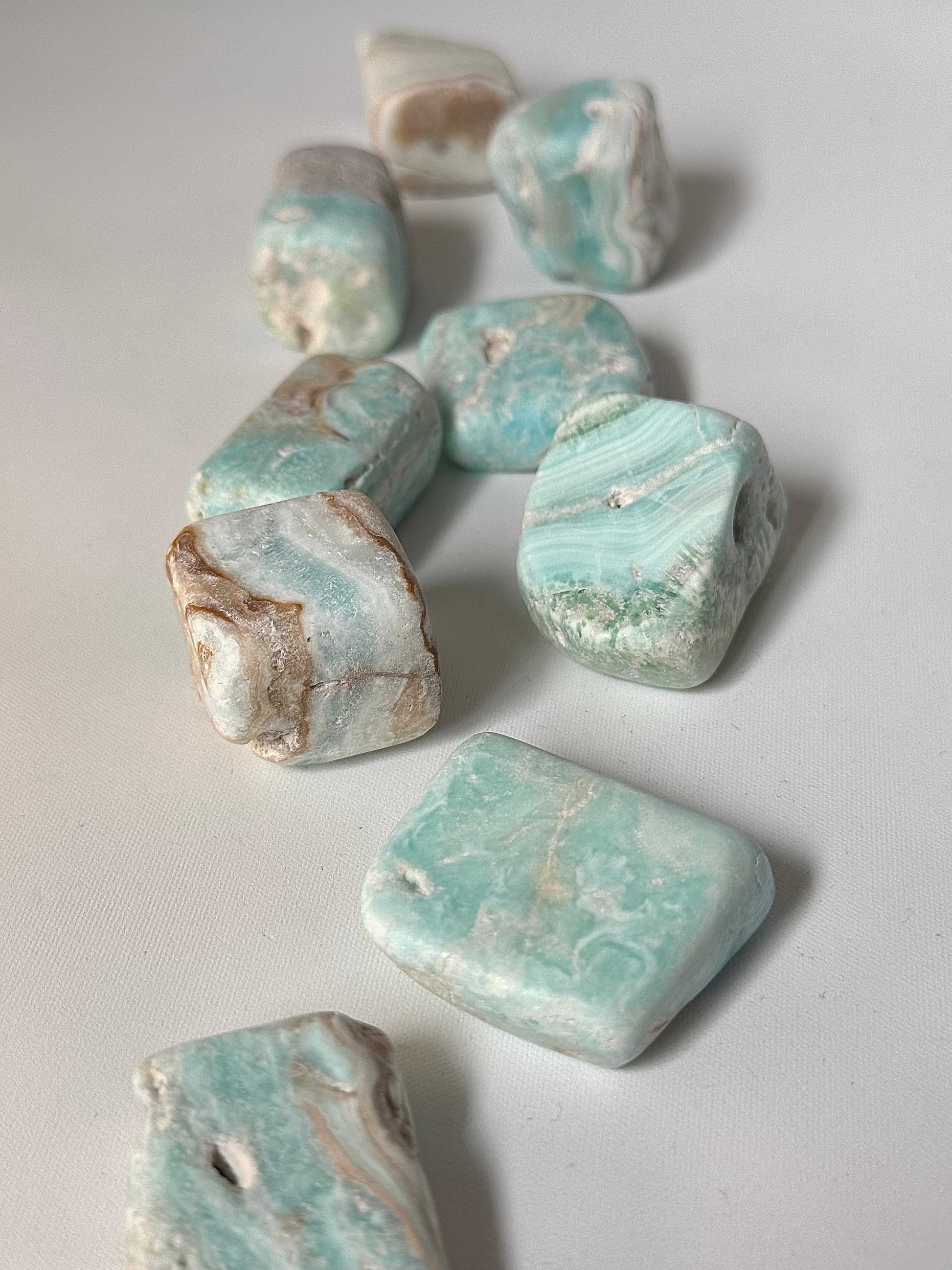 Polished Blue Aragonite Tumble Stones featuring unique patterns, perfect for spiritual practices and decorative rock collections in NZ crystal shops.