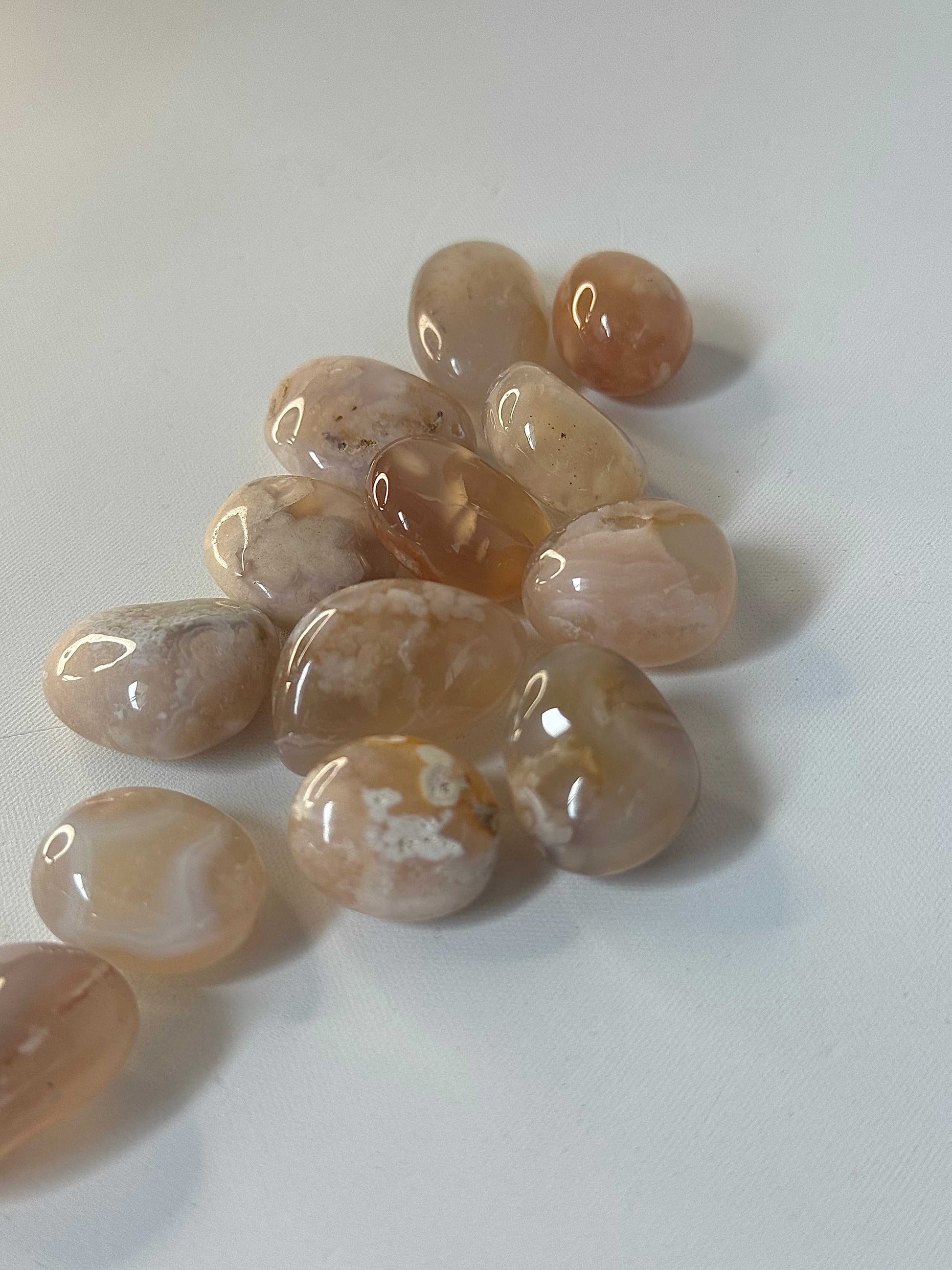 Polished Flower Agate tumble stones ideal for healing rituals and chakra alignment. Buy unique crystals online for spiritual and emotional wellness.
