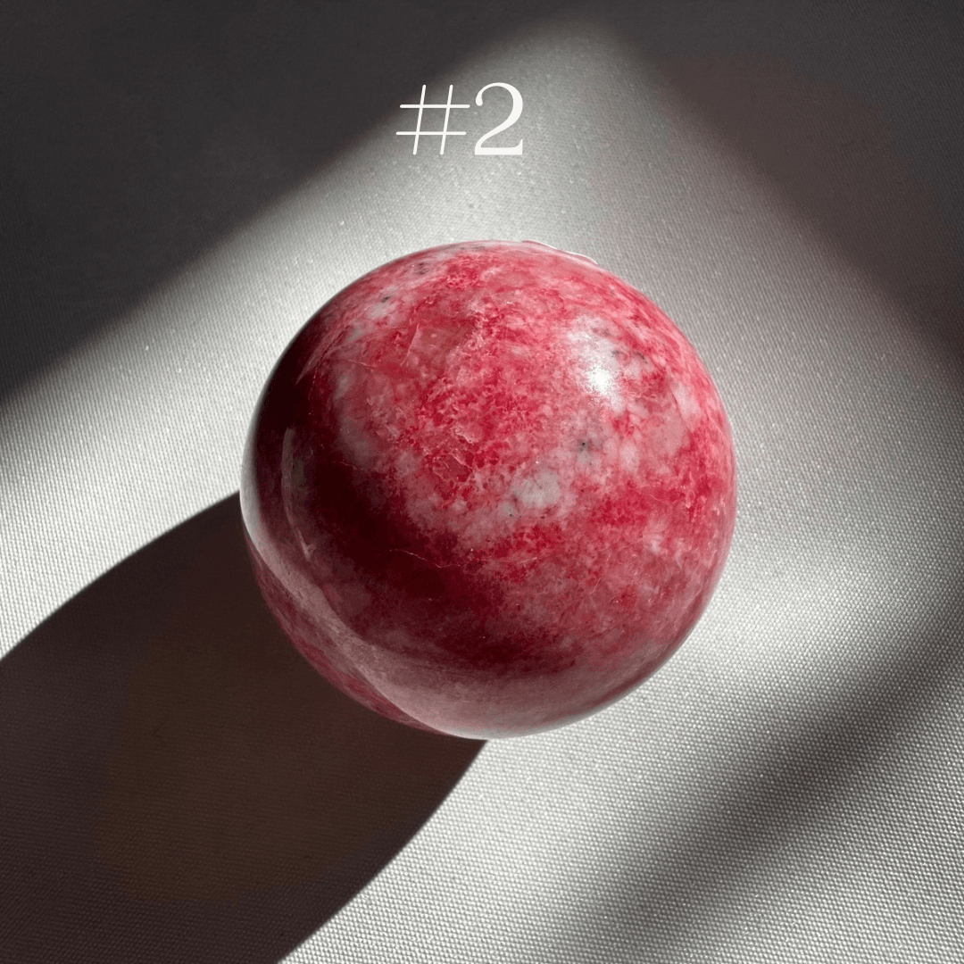 Pink Thulite Crystal Sphere #2 featuring soft pink hues and natural mineral patterns, perfect for crystal healing and gemstone collections.
