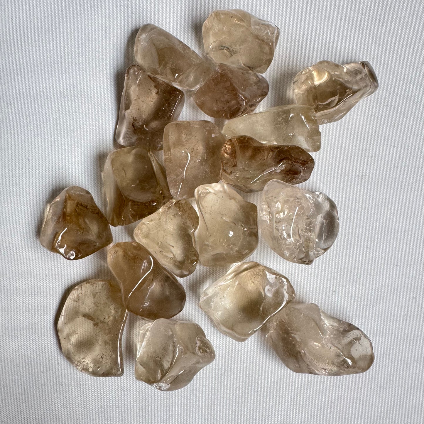 Medium Natural Citrine Tumble stones with clear yellow-brown hues, ideal for energy and creativity enhancement in gemstone collections.
