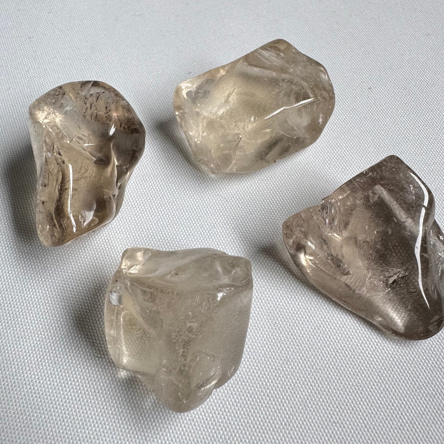 Close-up of polished Medium Citrine Tumble gemstones showcasing clarity and smooth texture, perfect for crystal healing and decor.