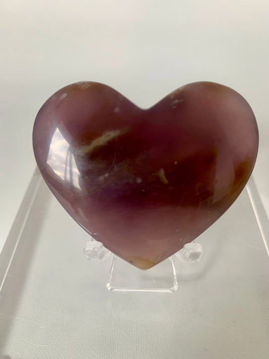 Purple Chalcedony Heart gemstone with smooth polished surface on clear display stand. Buy Chalcedony NZ for collectors and crystal lovers.