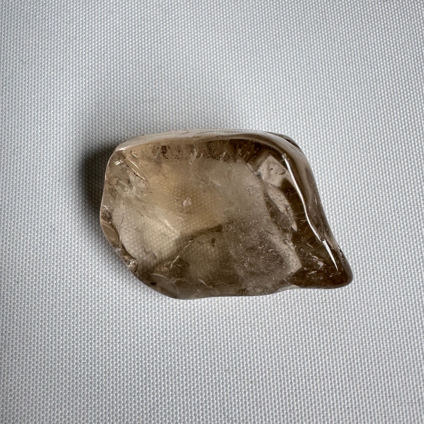 Single large natural citrine tumble stone with smooth polished surface and warm golden tone, perfect for meditation. Citrine Tumble Stones - Large Natural Citrine.