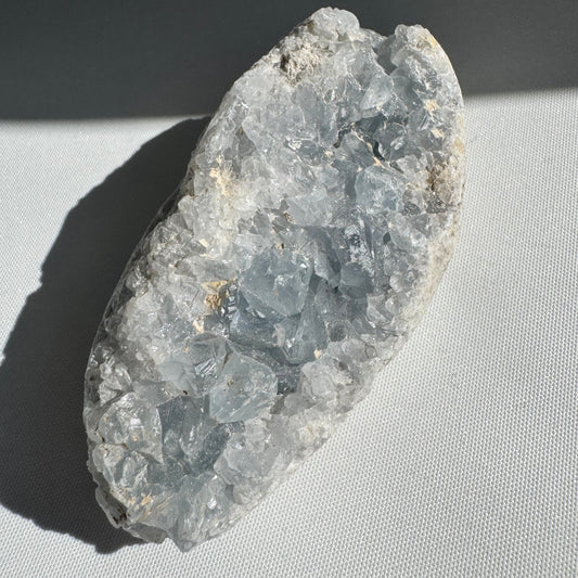 Celestite Cluster #4 with shimmering blue druzy crystals, ideal for peace and wisdom. A unique collectible rock from Crystals NZ.