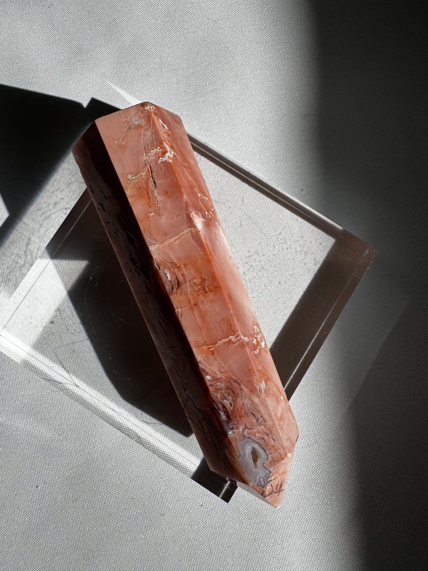 Side view of Cotton Candy Agate Crystal Point #1 showing deep peach tones and natural veining, ideal for crystal collectors and enthusiasts.