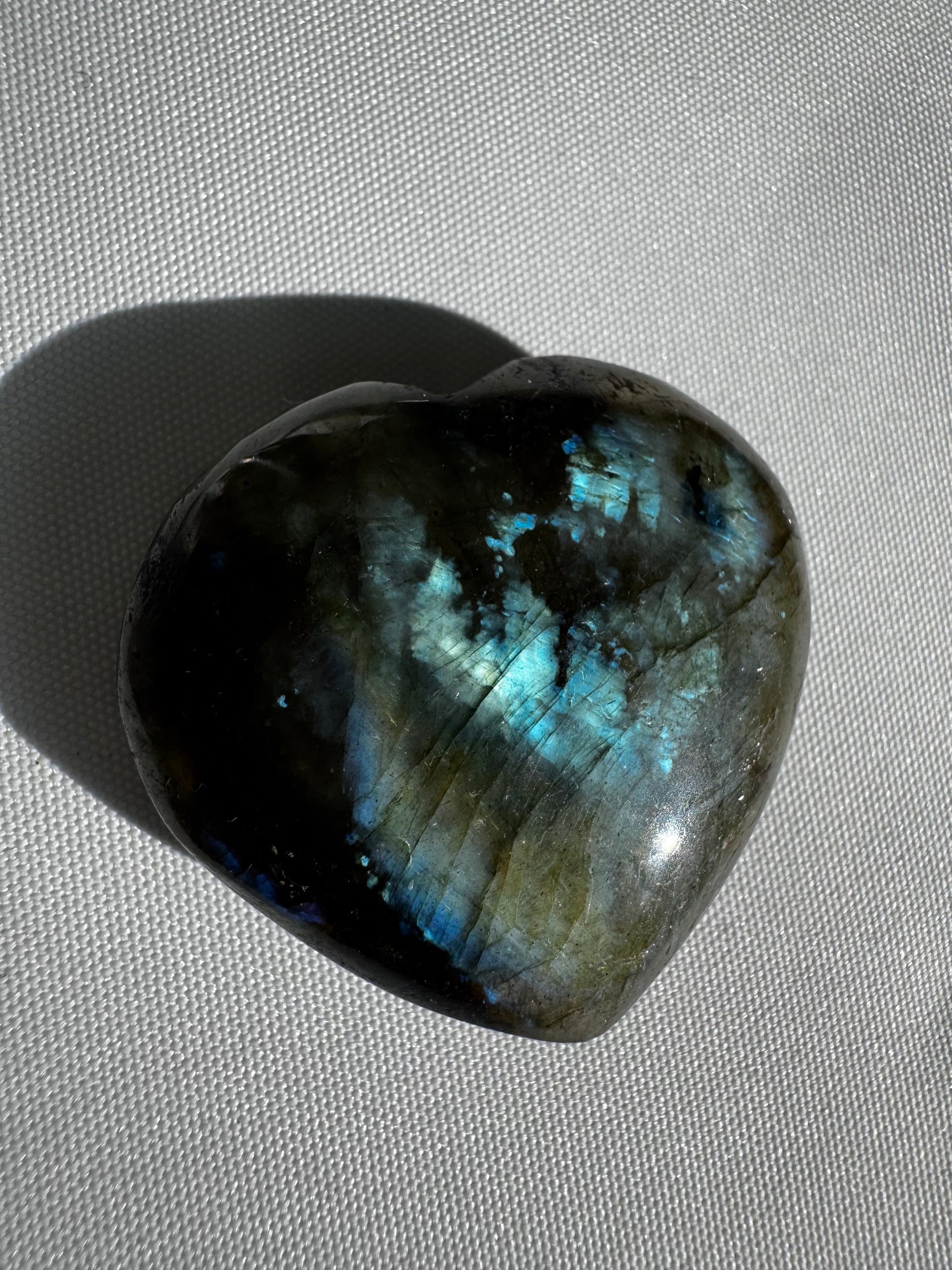Labradorite Crystal Mini Heart with vivid blue and green iridescence, handcrafted from Madagascar rainbow labradorite for bespoke crystal collectors.