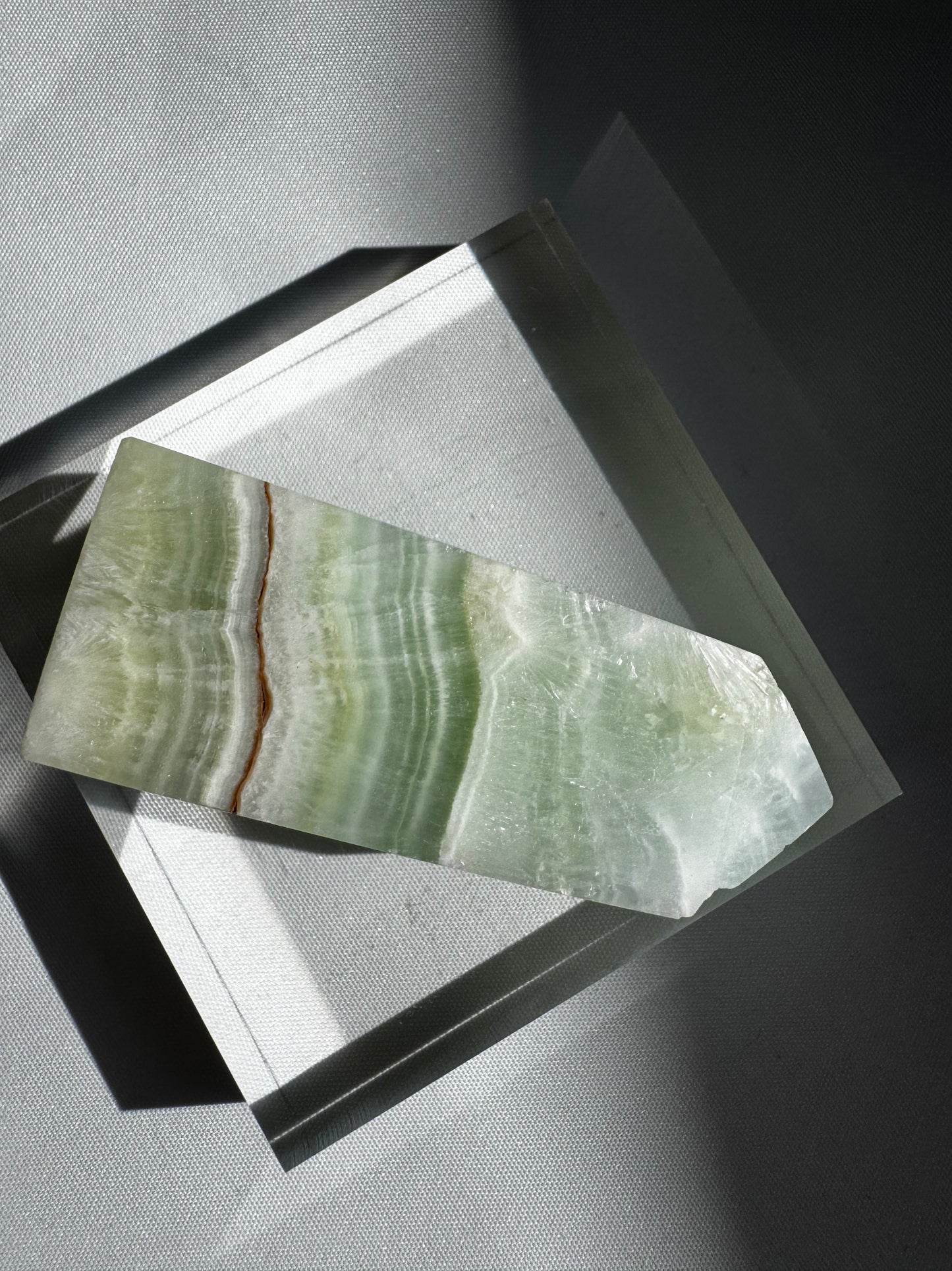 Angled top view of Pistachio Calcite Mini Tower #6 | Bespoke Crystals
