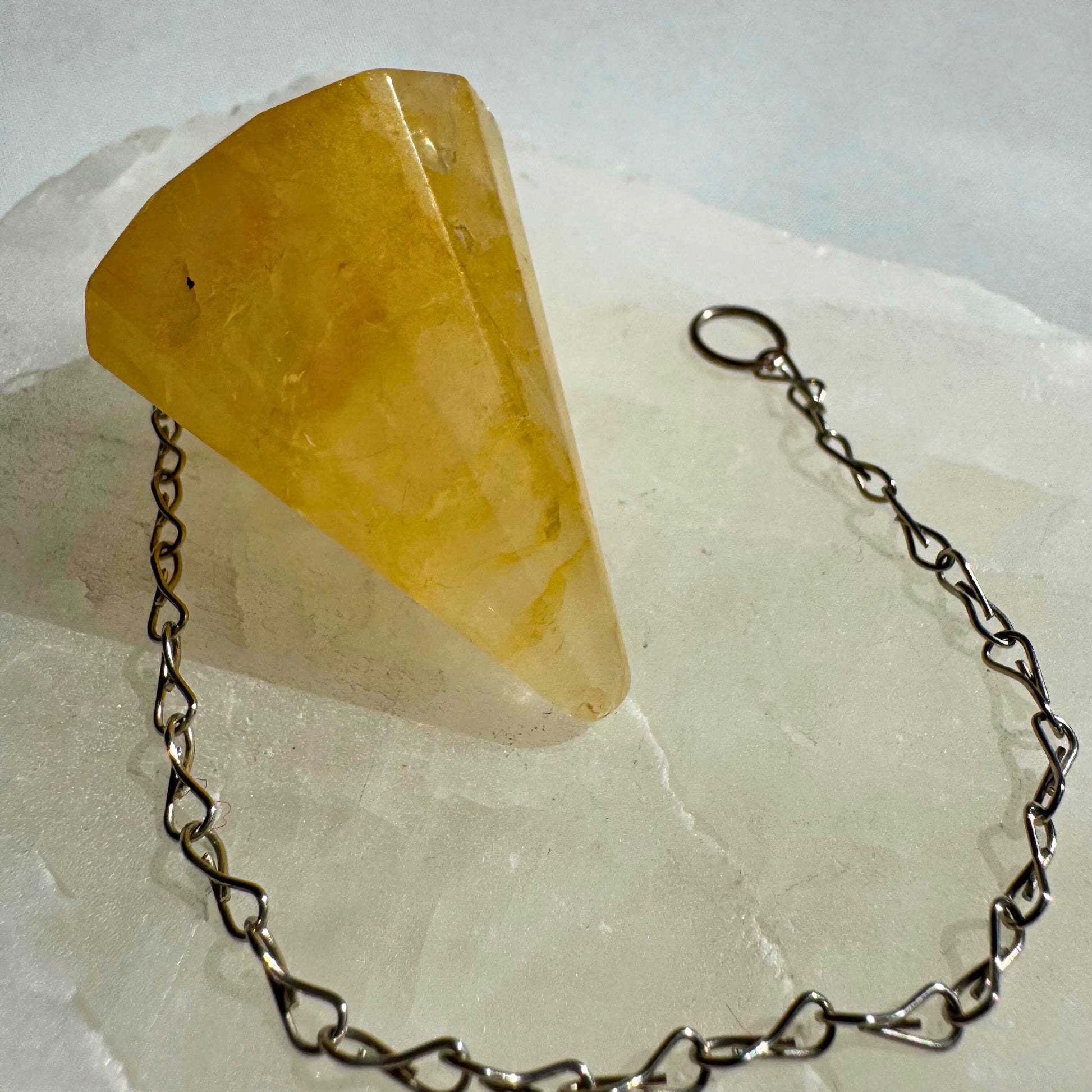Golden Healer Crystal Pendulum with faceted point and silver chain, ideal for dowsing, divination, and energy healing practices | Bespoke Crystals NZ